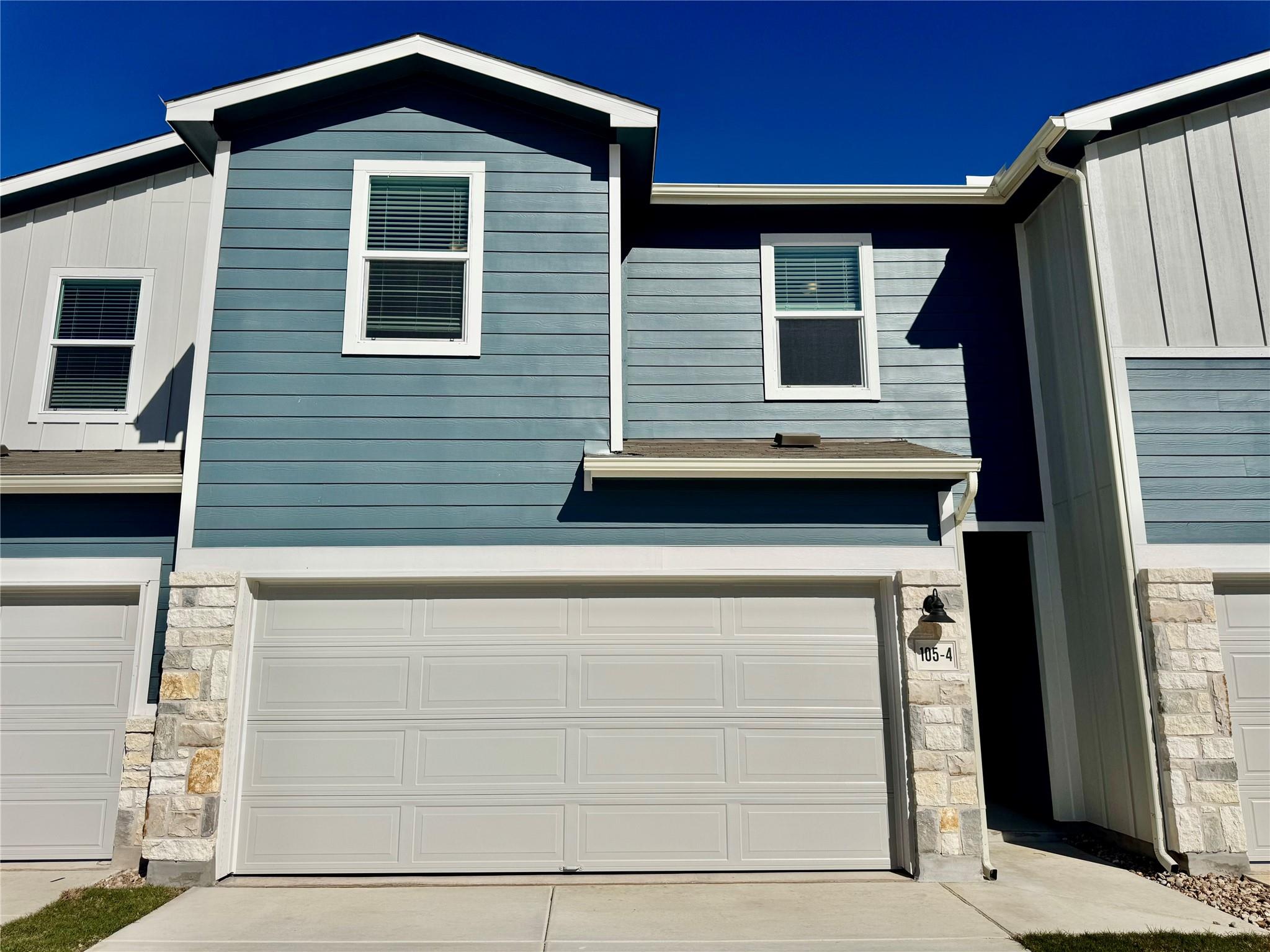 View of front of property featuring stone siding 