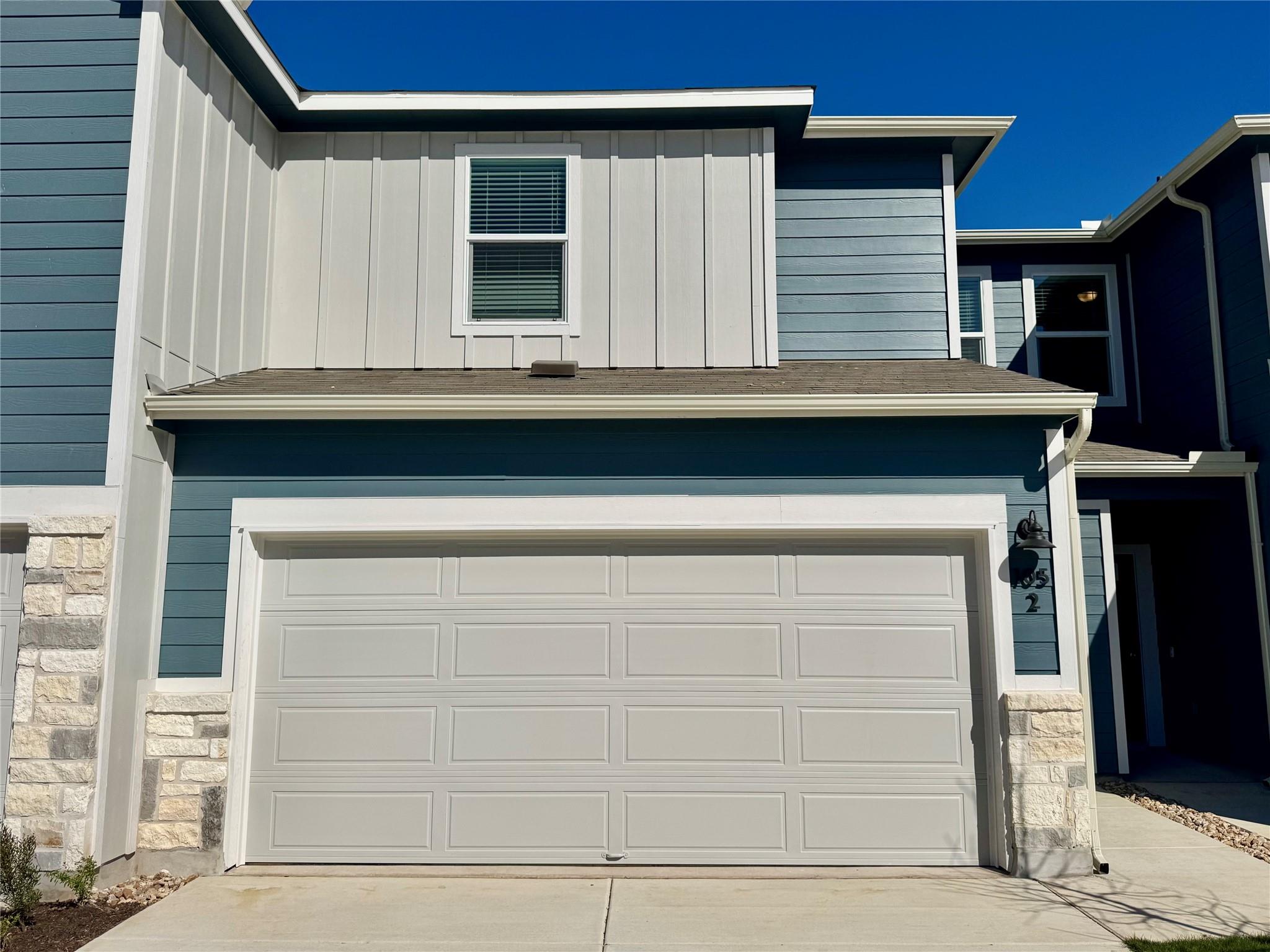Garage with concrete driveway