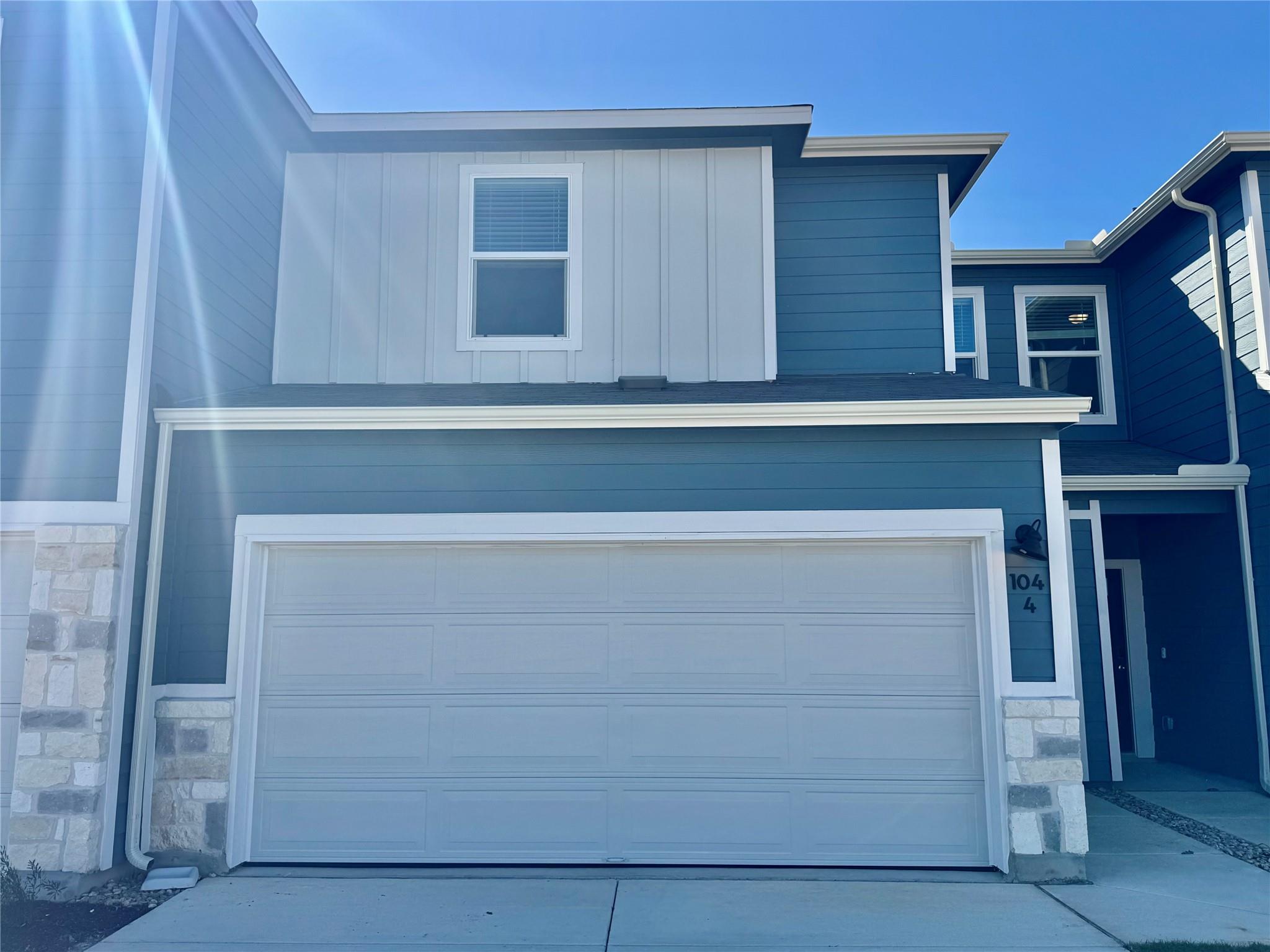View of front of property featuring stone siding,