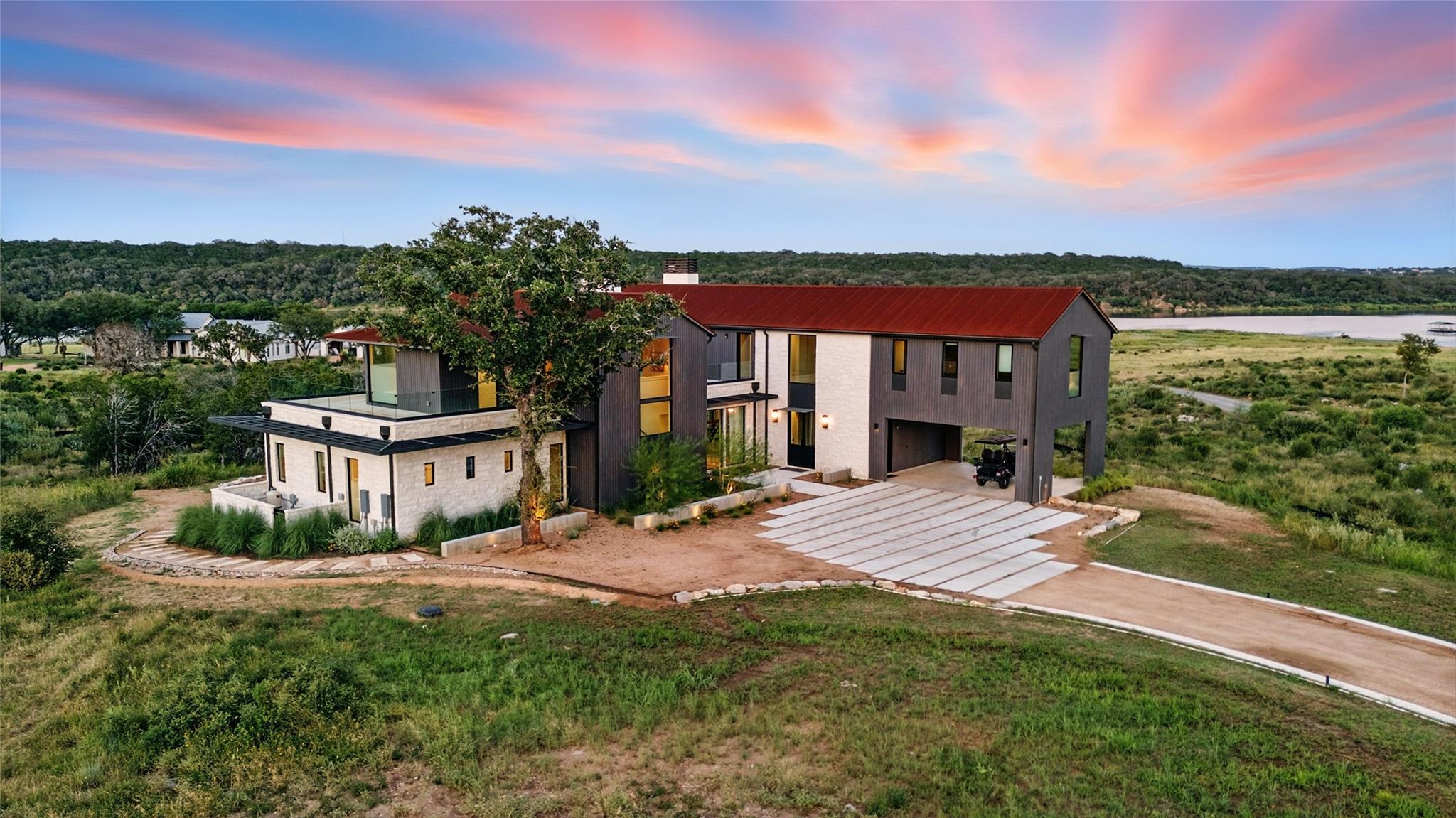 Contemporary house featuring a chimney, a balcony