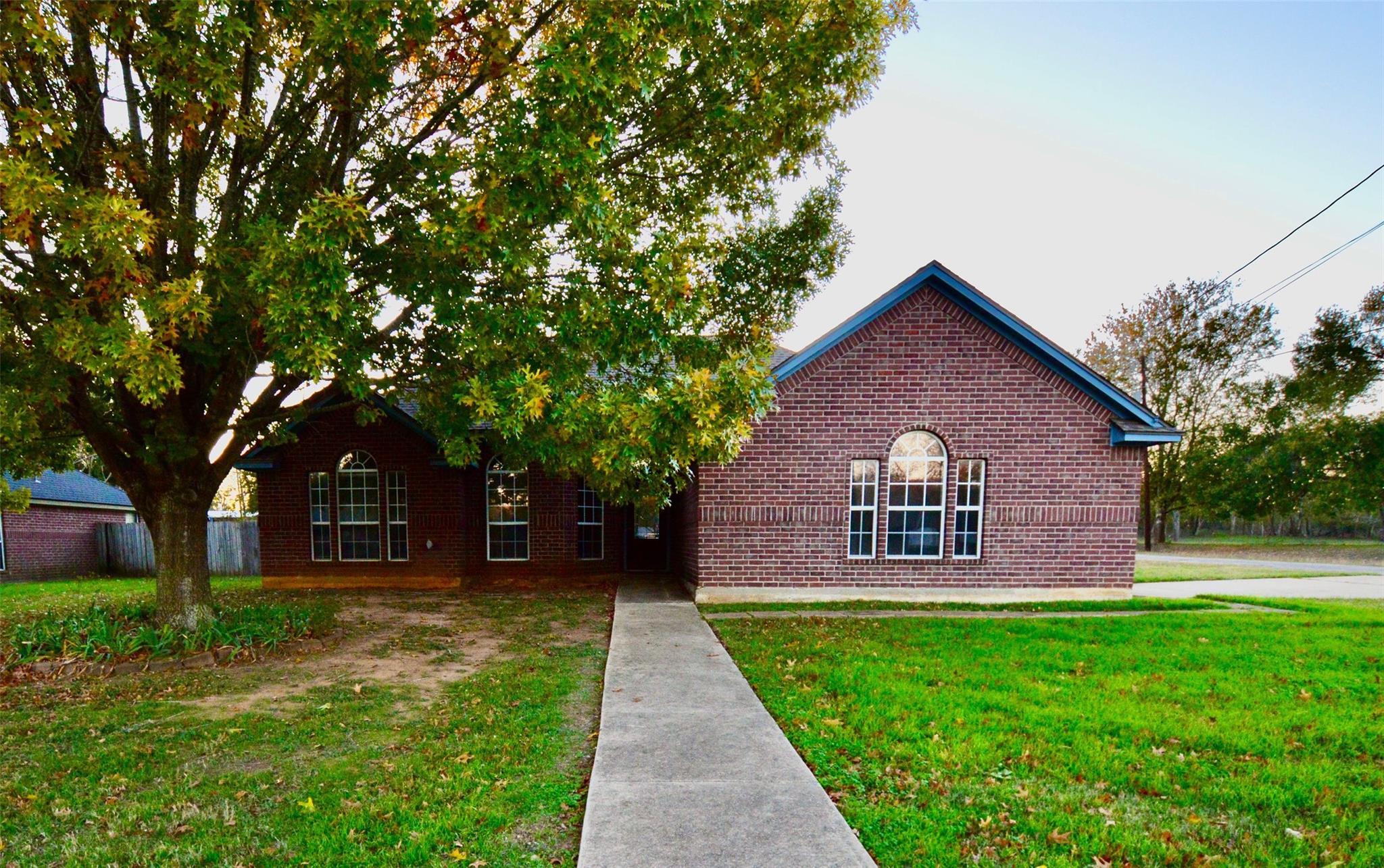 View of front of house featuring brick siding and