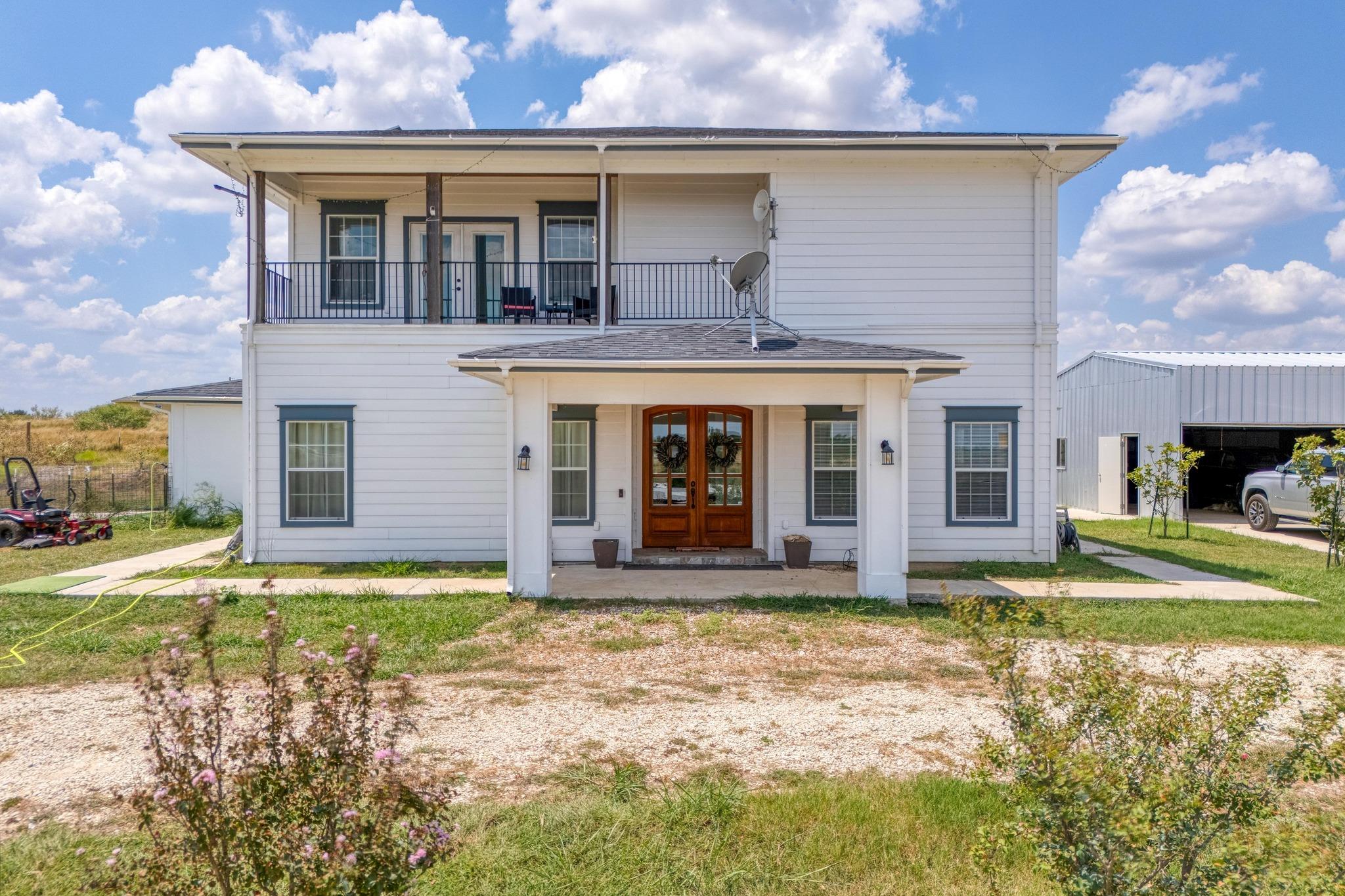 View of front of house featuring french doors and