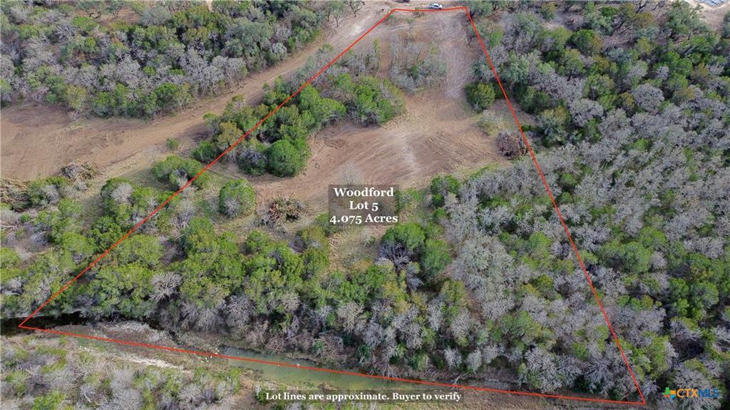 Expansive 4.075-acre lot featuring mature trees, 