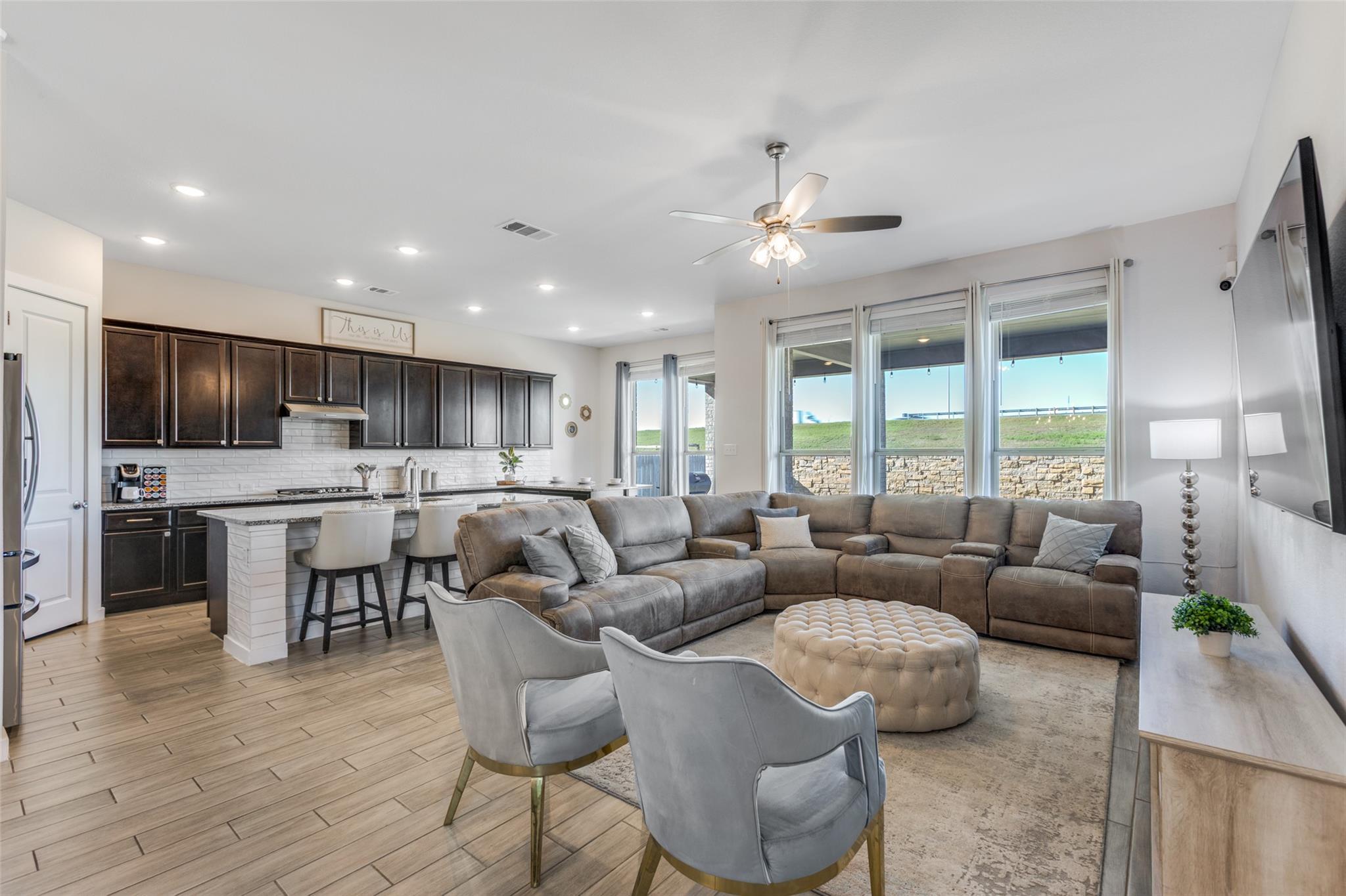 Living room featuring recessed lighting, light wo