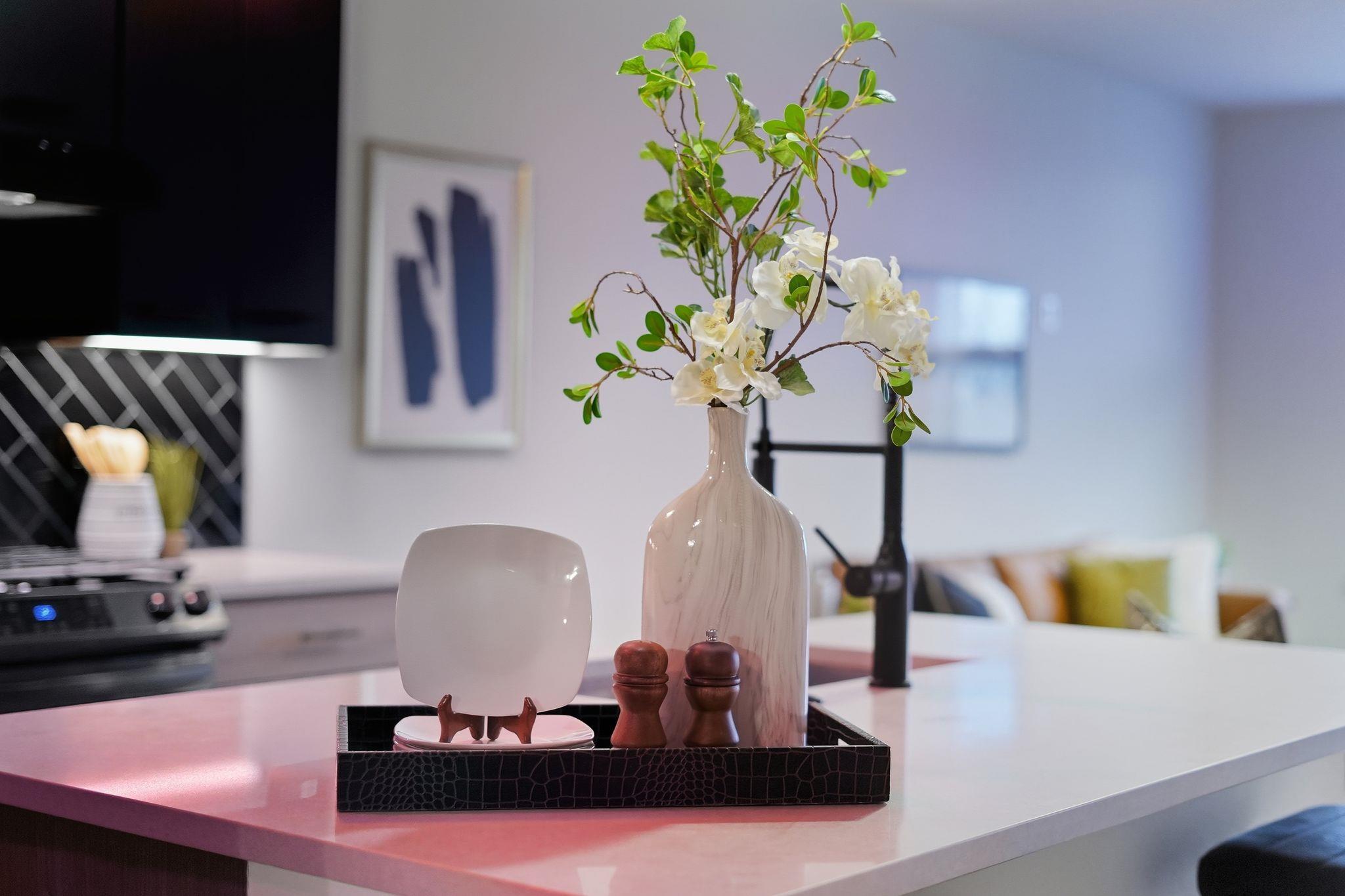 Kitchen view of a breakfast bar, light stone coun