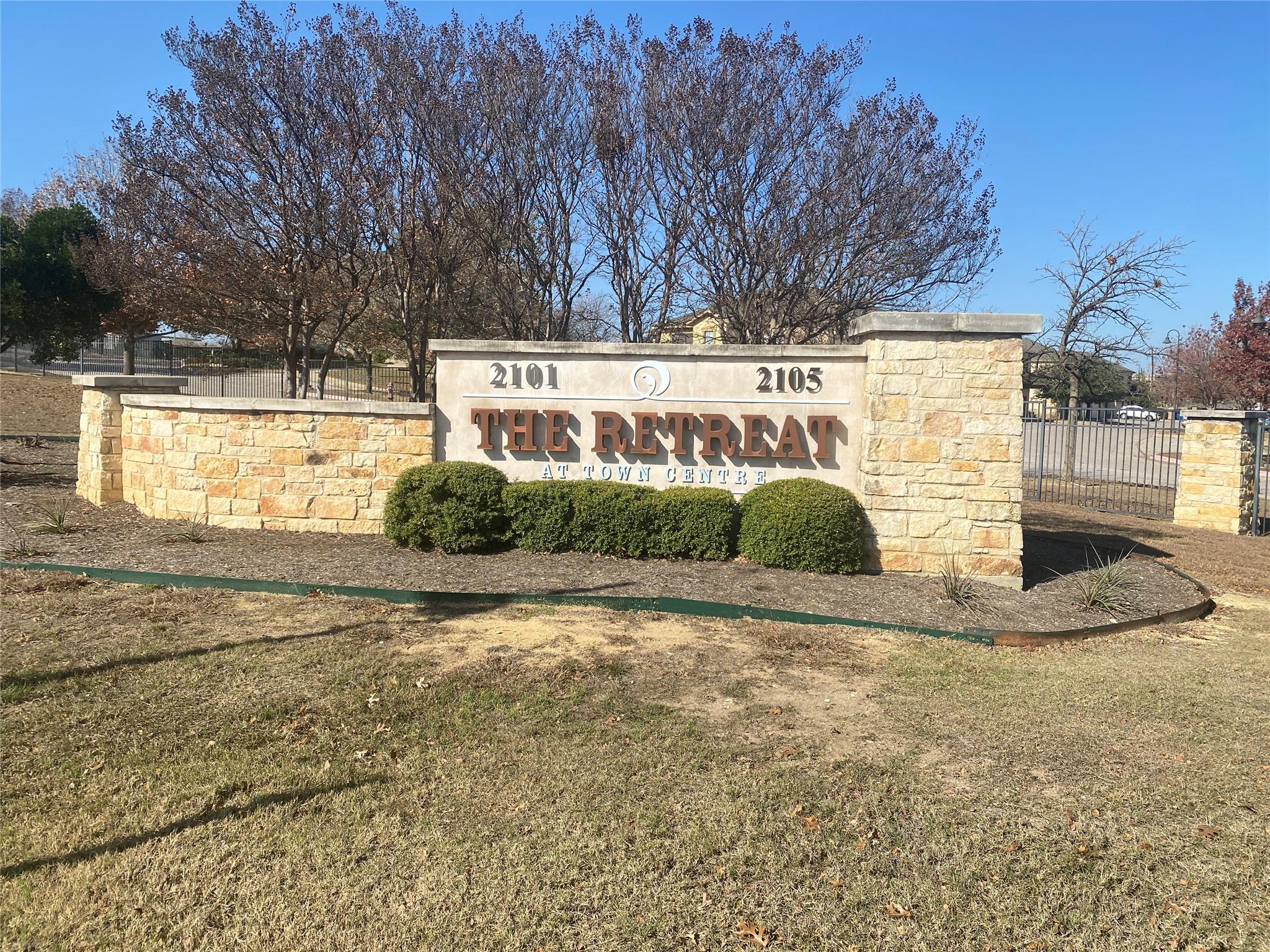 Community sign with a lawn
