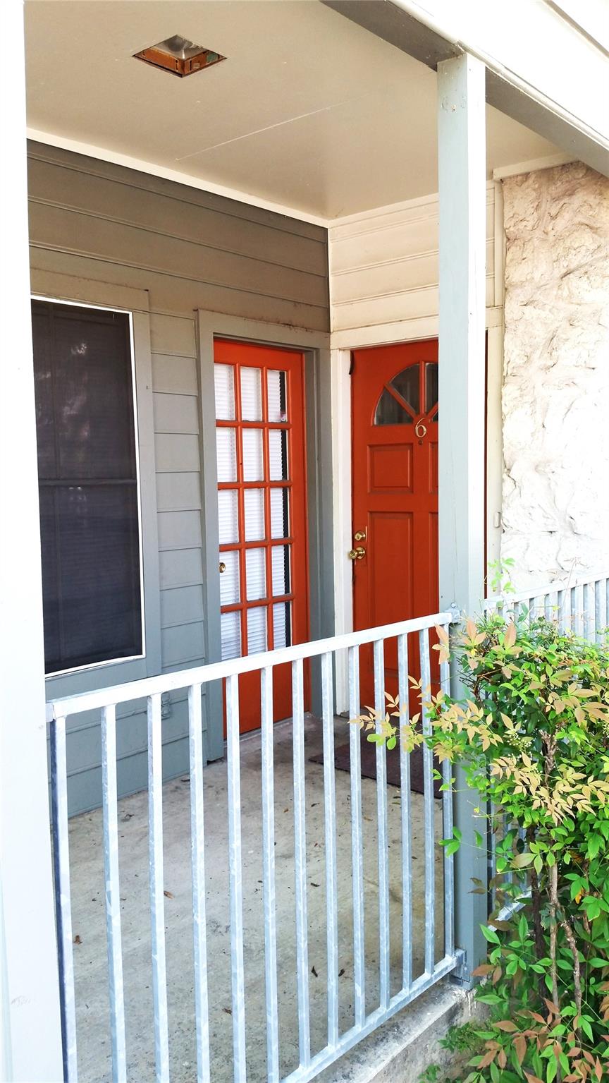 View of exterior entry featuring a porch