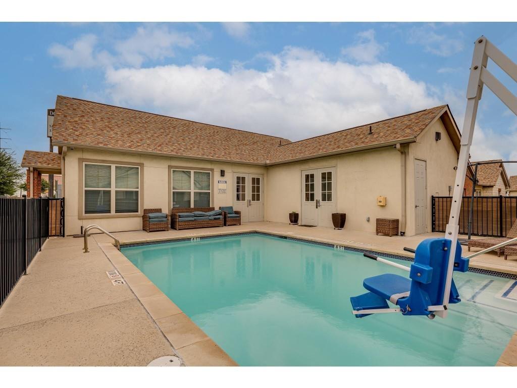 Community pool featuring a patio