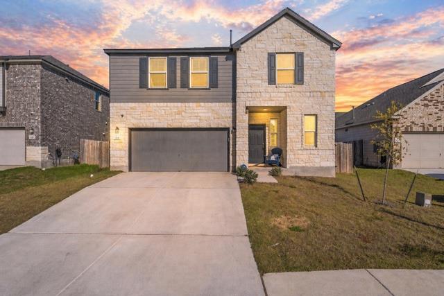 Stone and siding exterior with dark shutters, fea