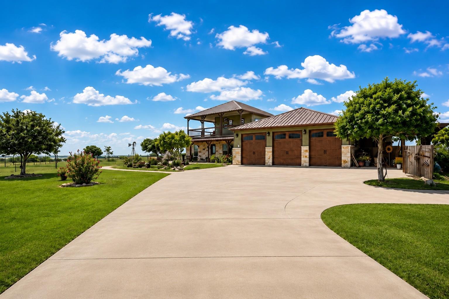 A spacious concrete driveway guides to a beautifu