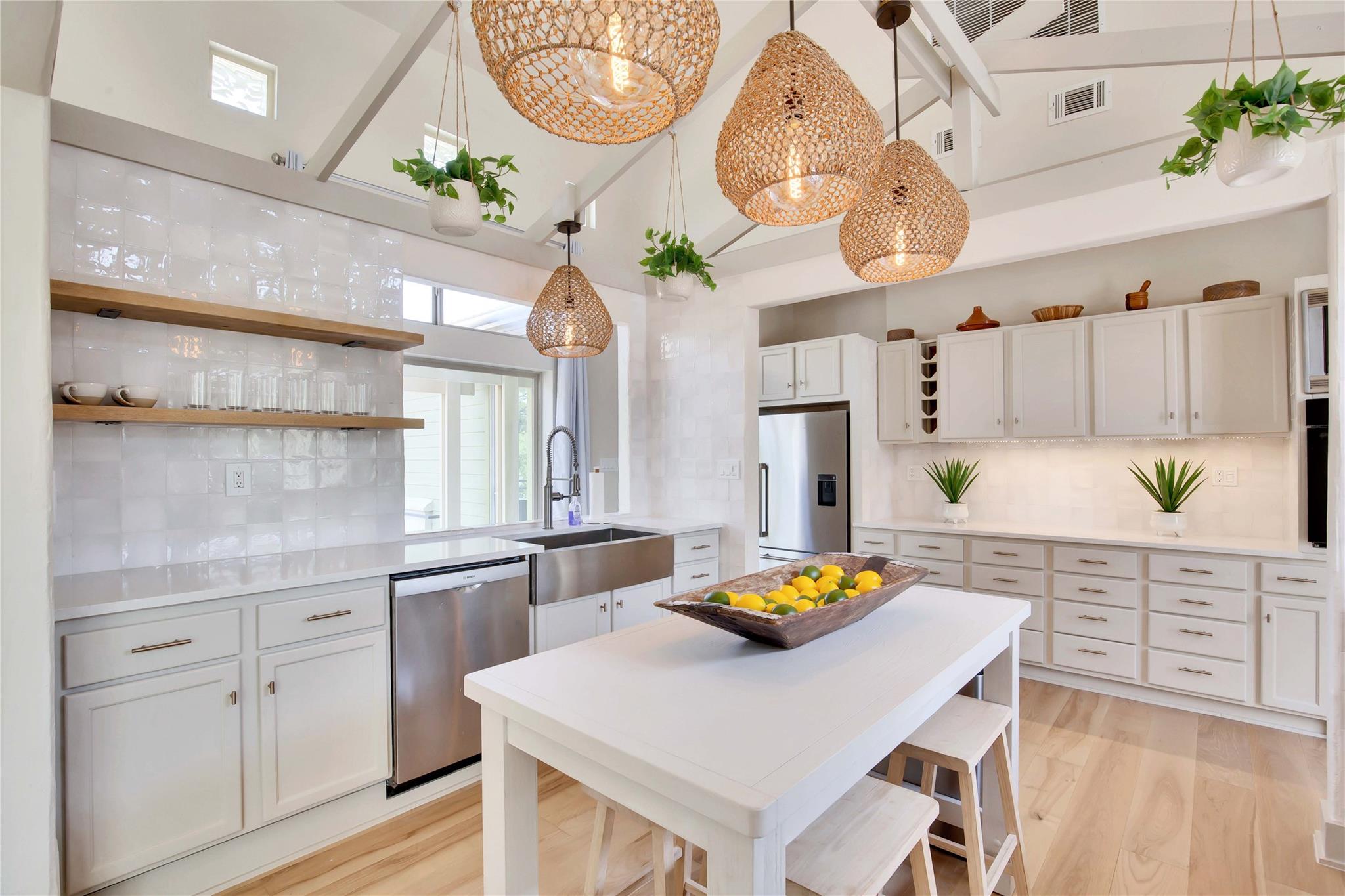 Kitchen with open shelves, tasteful backsplash, w