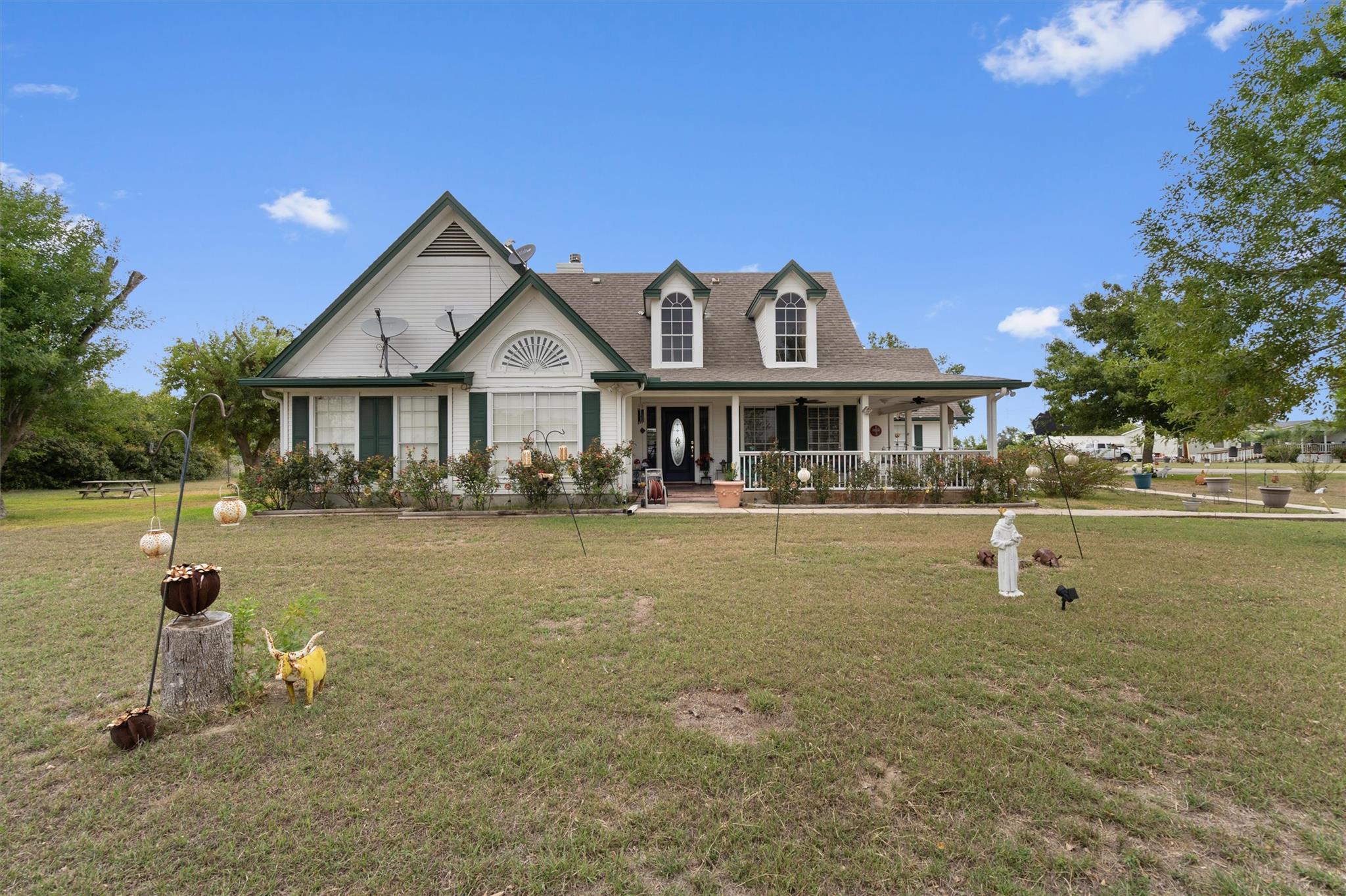 View of front of house featuring covered porch an