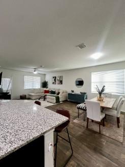 Kitchen with light stone countertops, healthy amo