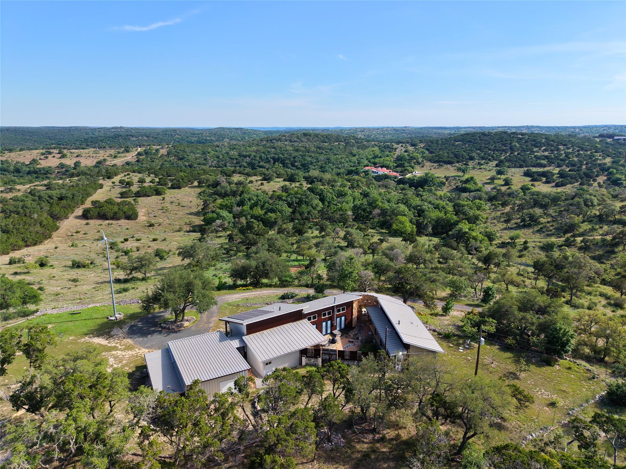 Perched on a verdant hillside, this residence off