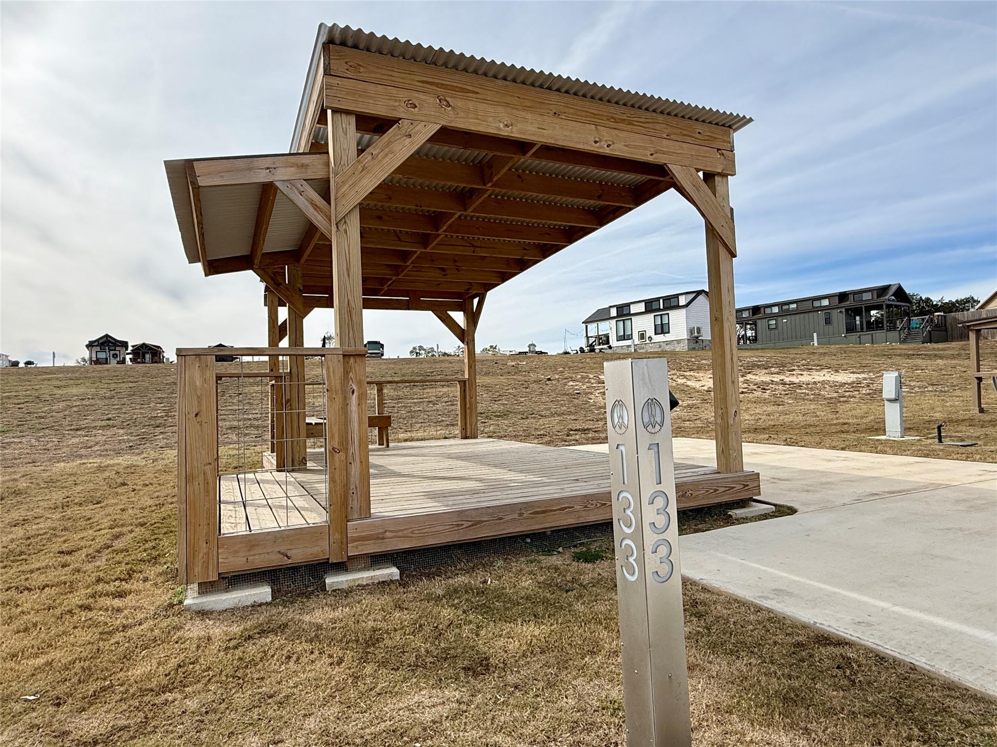 Wooden deck featuring a lawn