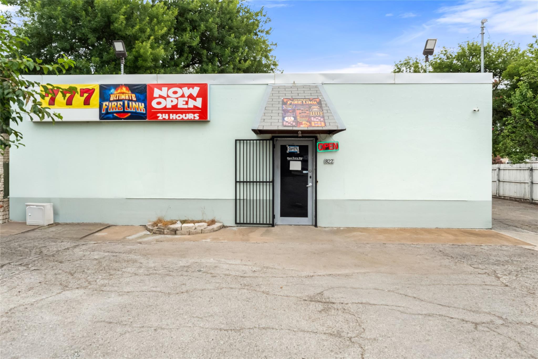 Secure storefront with a covered entry and ample 