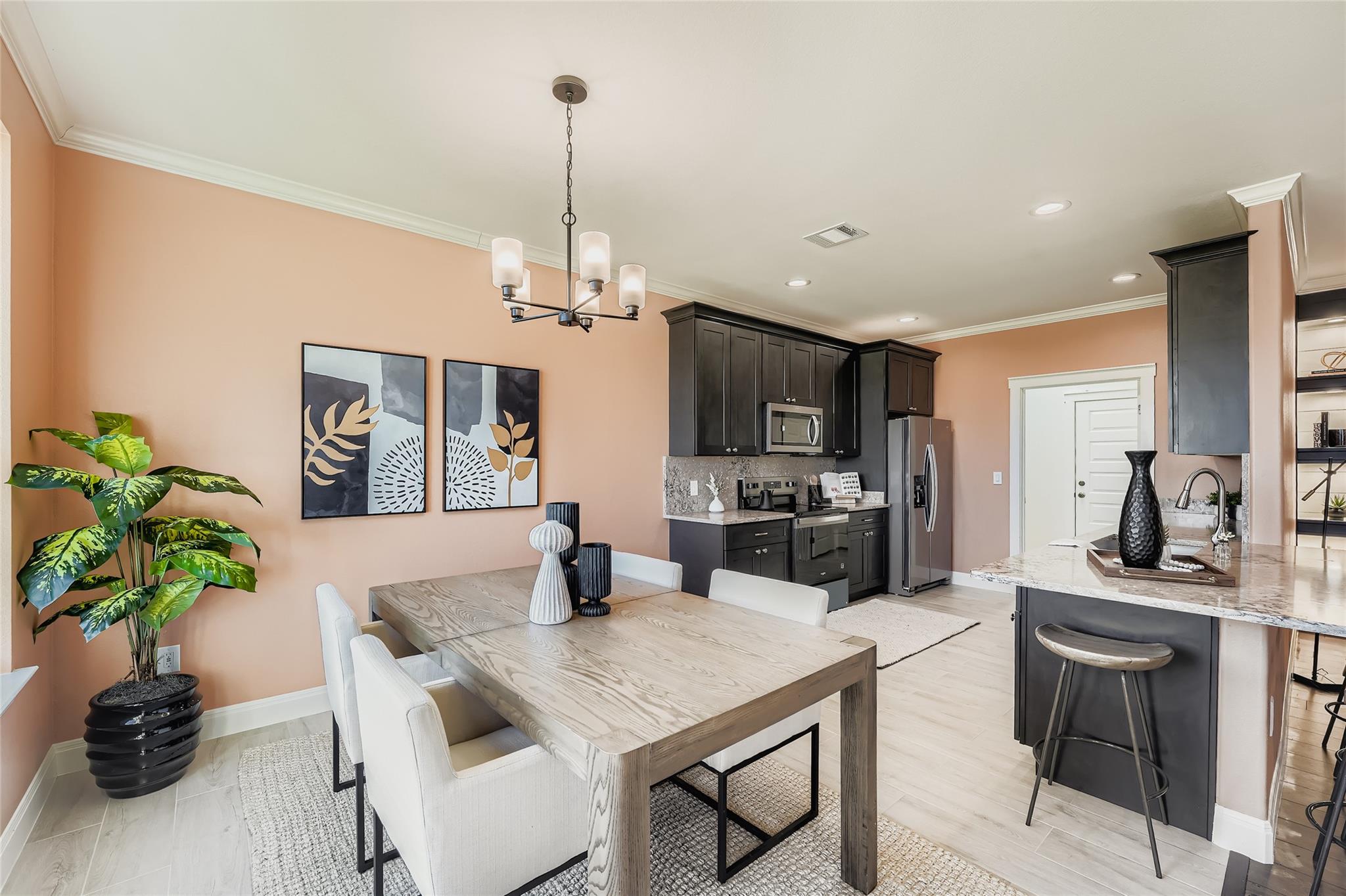 Dining room featuring crown molding, a chandelier