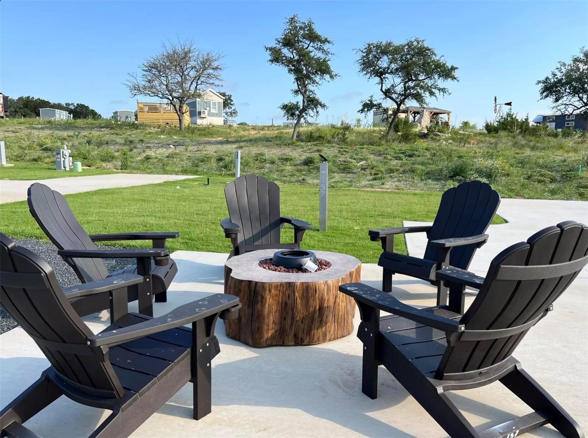 View of patio featuring an outdoor fire pit