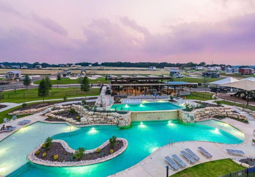 Community pool featuring a patio and a jacuzzi