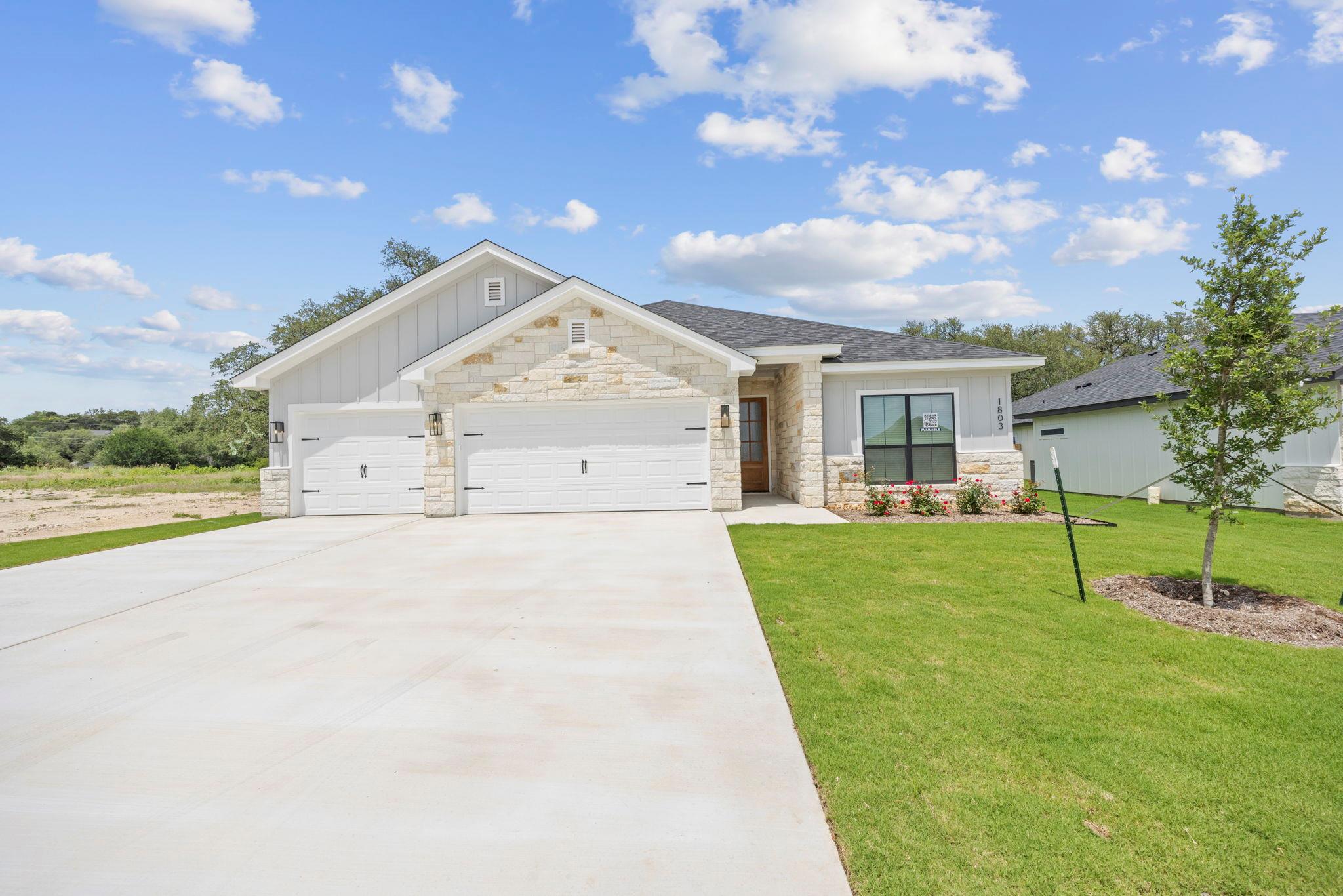 A newly built residence with a spacious driveway 