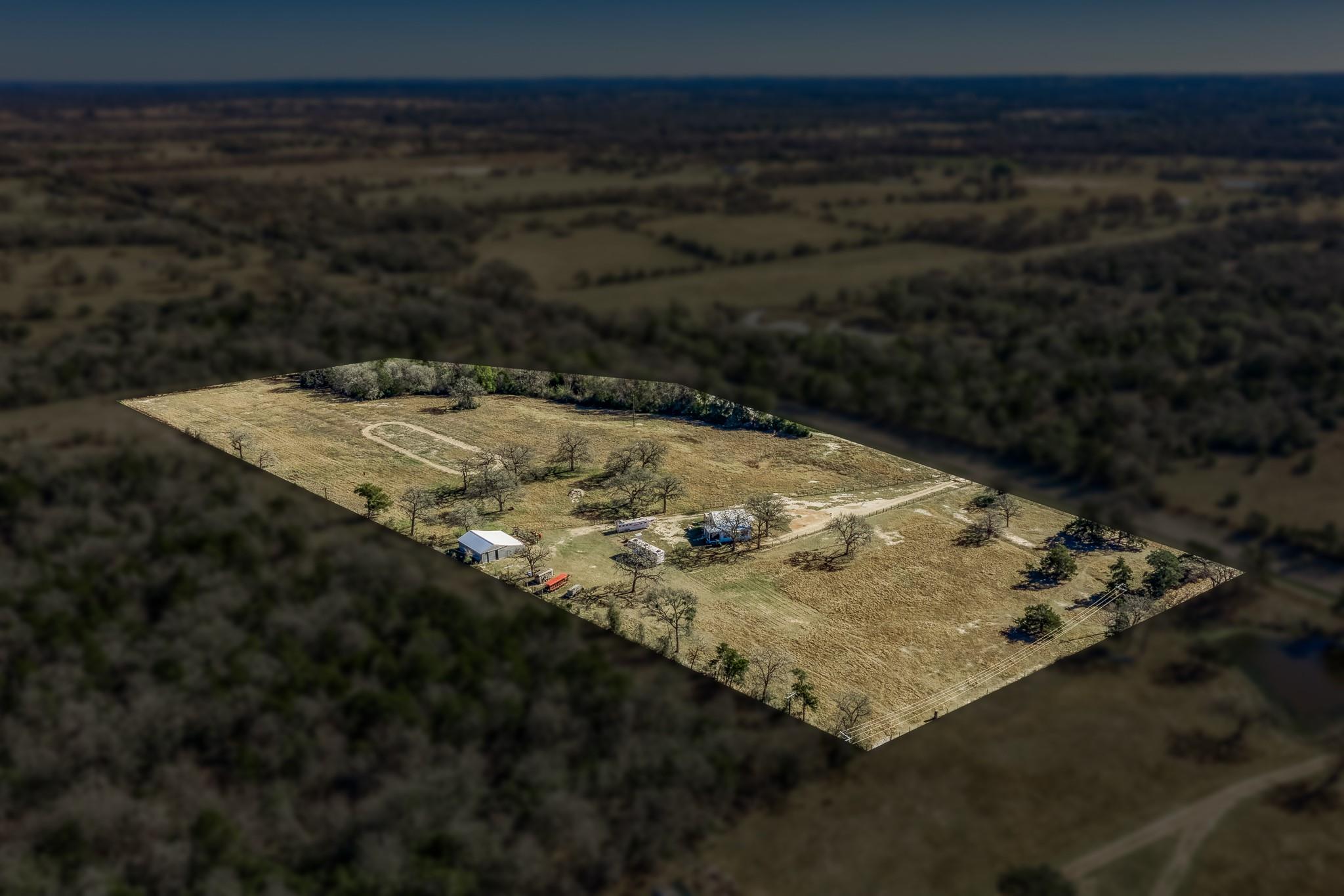Aerial view of property and surrounding area with