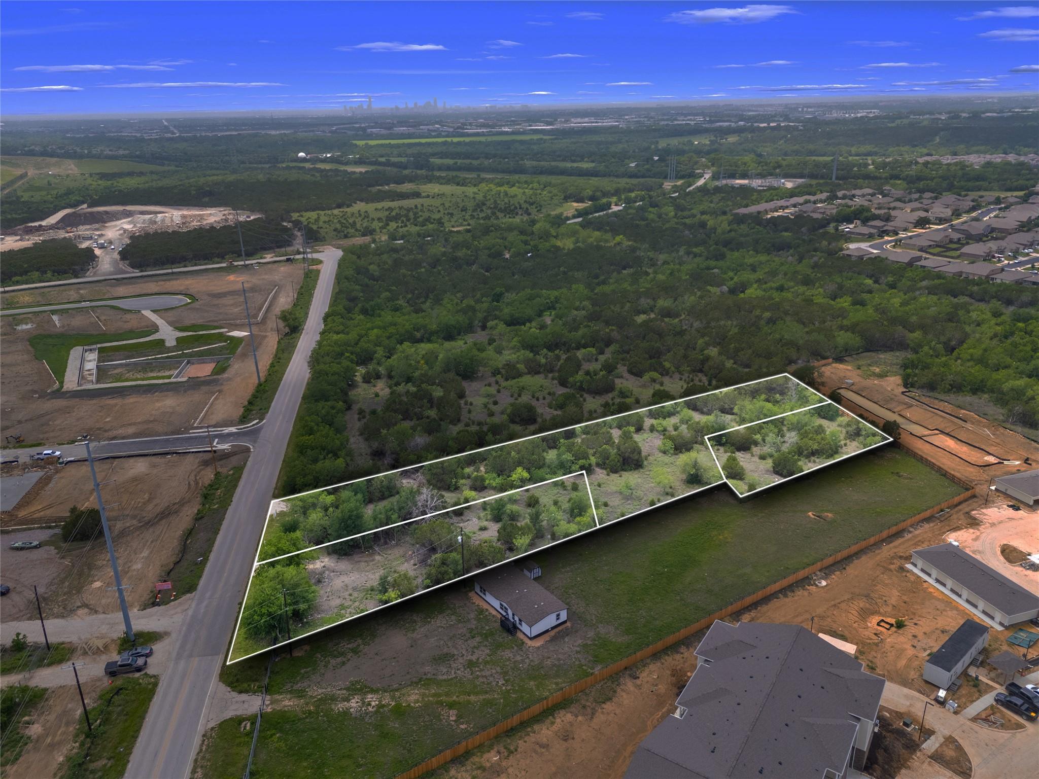 Expansive land parcel featuring existing tree cov