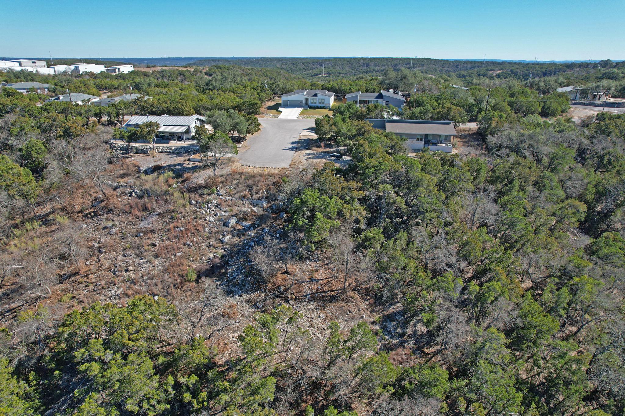 Aerial view of property and surrounding area with