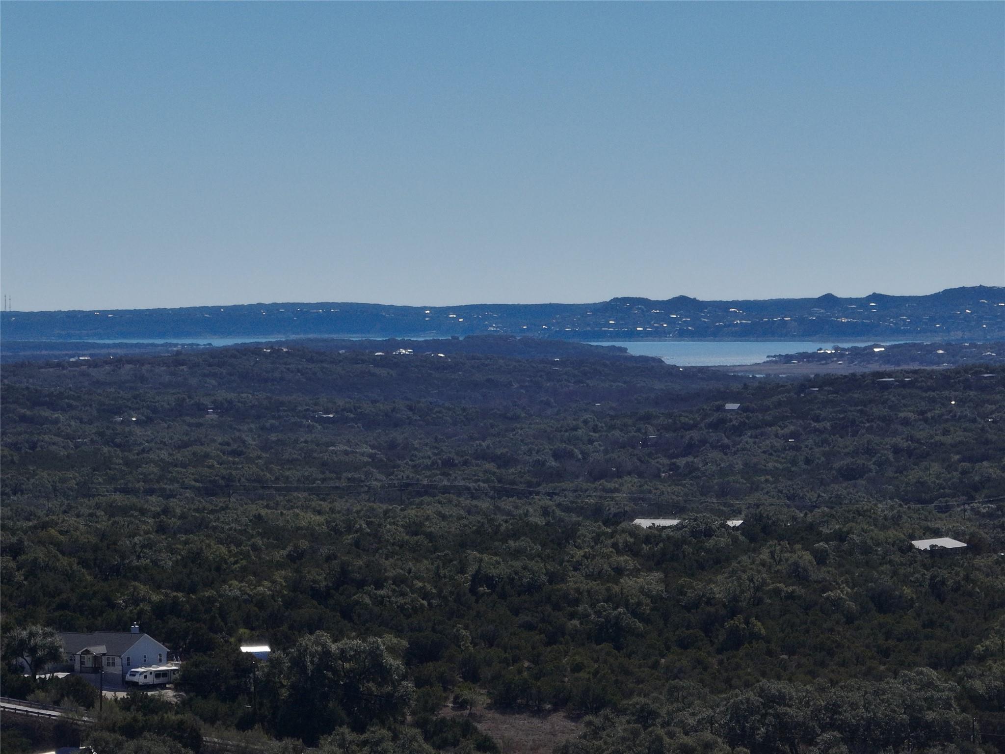 Water view featuring a heavily wooded area