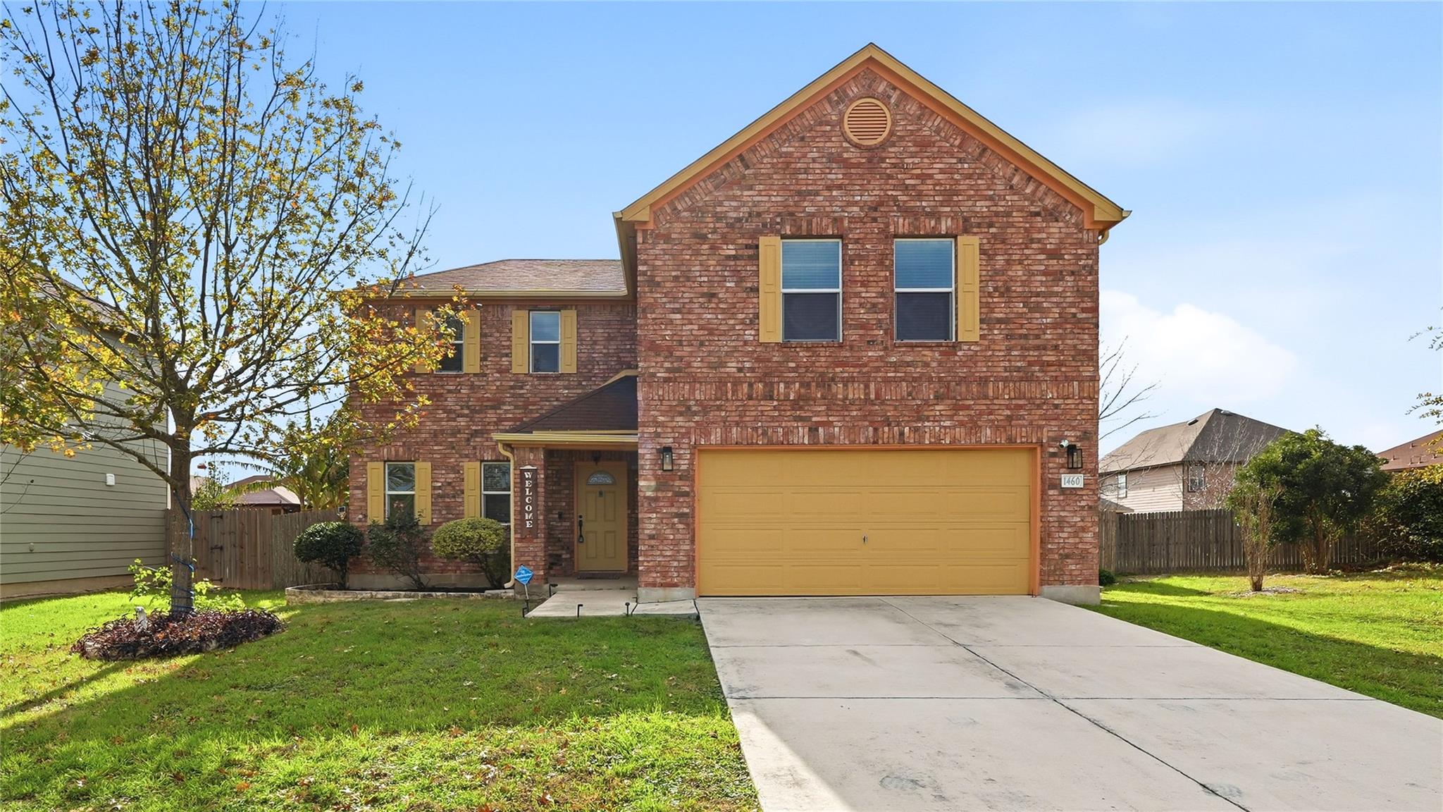 Traditional-style home featuring brick siding, co