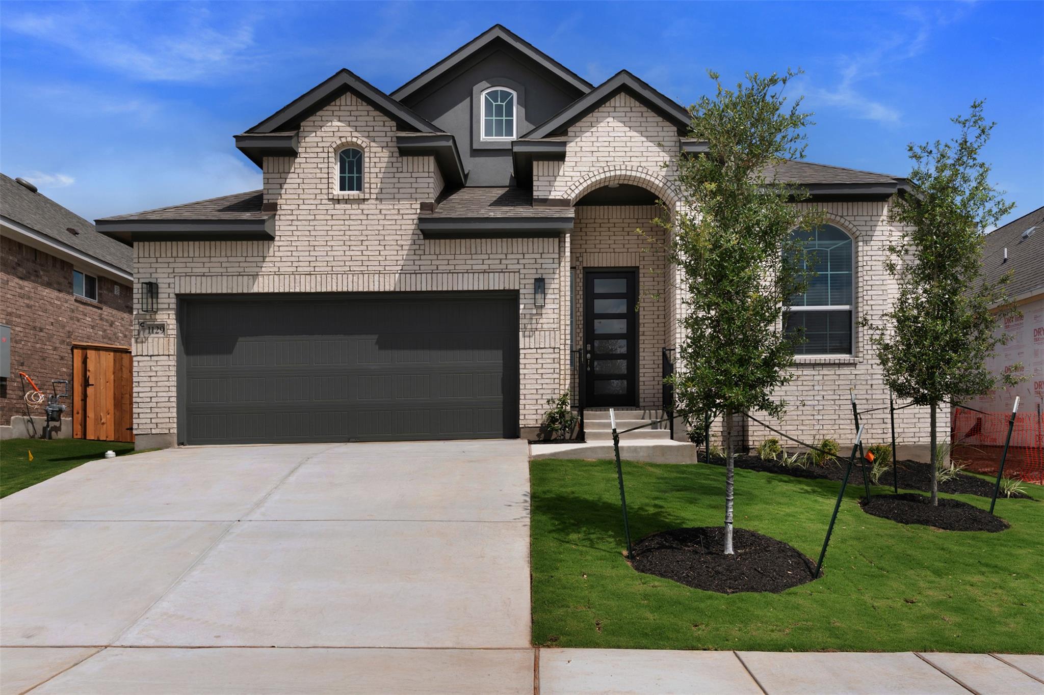 Contemporary two-story residence featuring a ligh