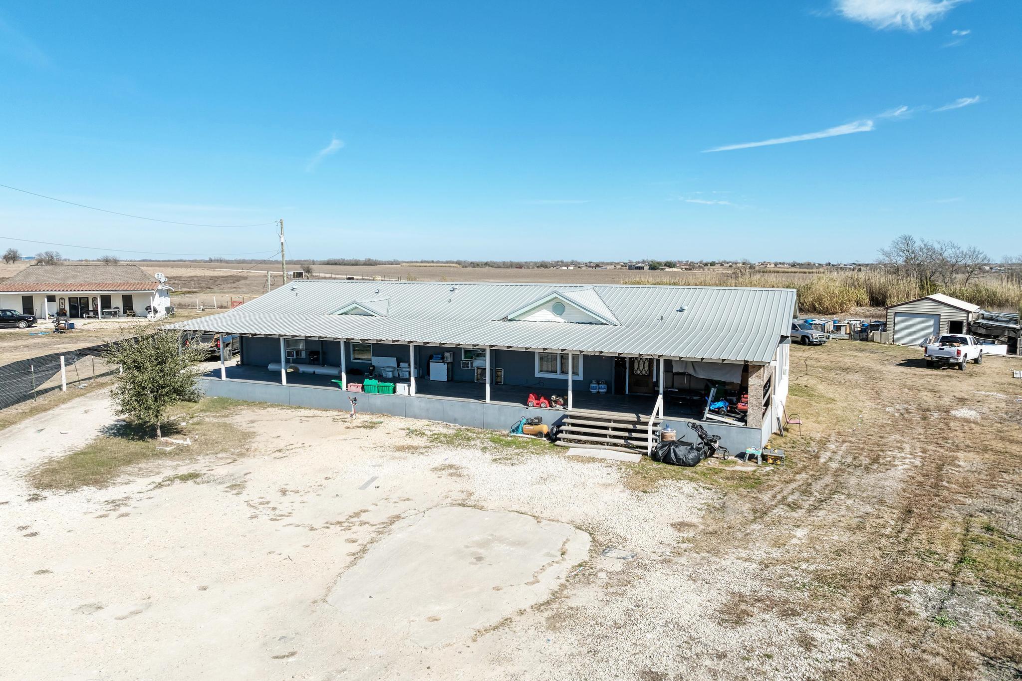 View of front of property featuring a metal roof,