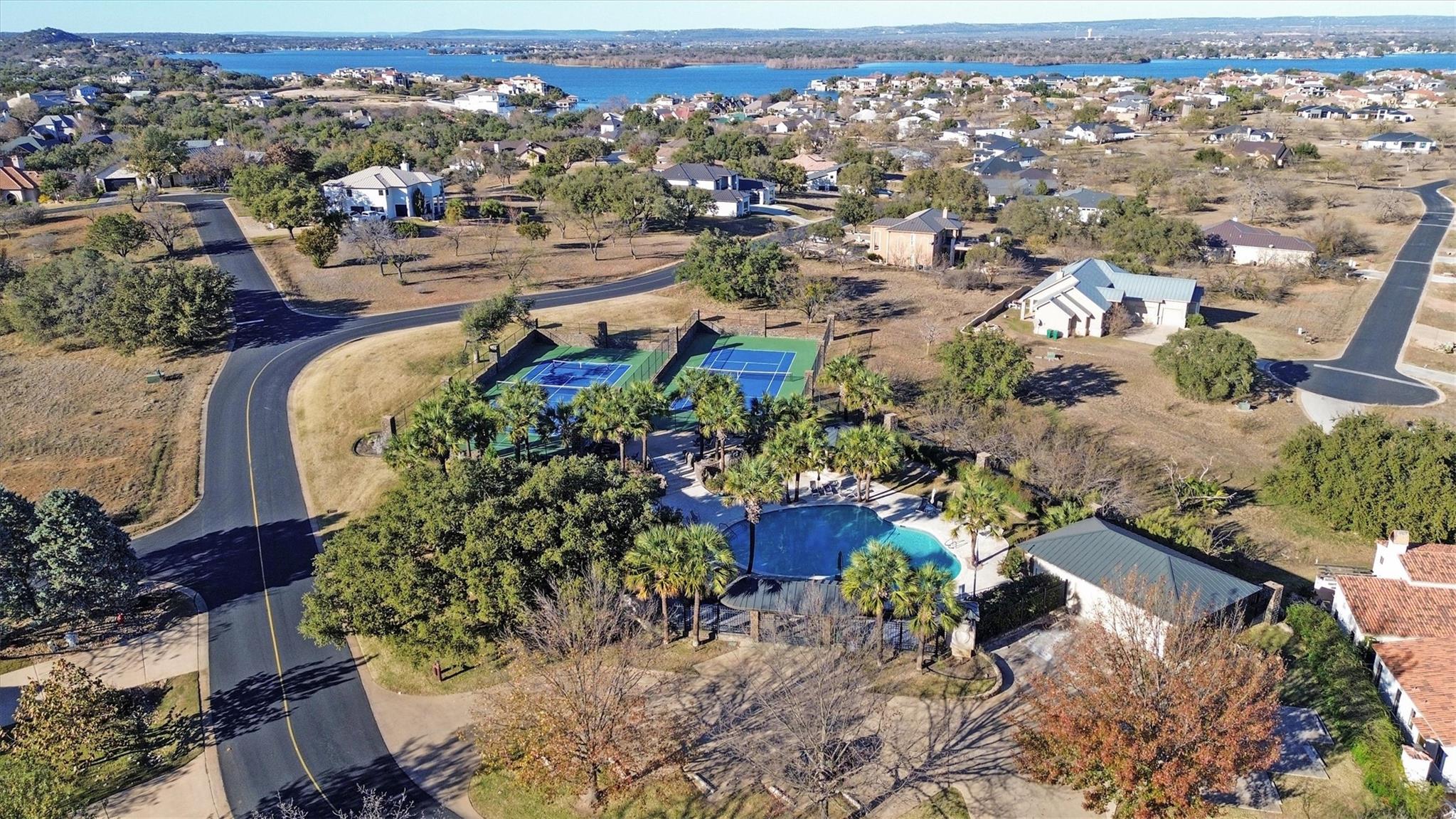 Drone / aerial view of a pool area and a large bo
