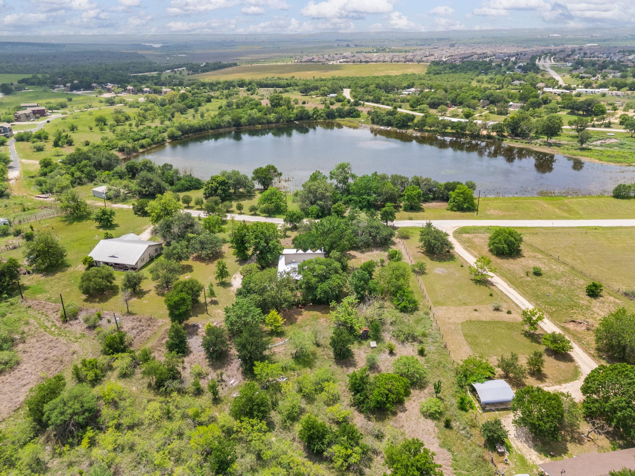Aerial view of property and surrounding area with