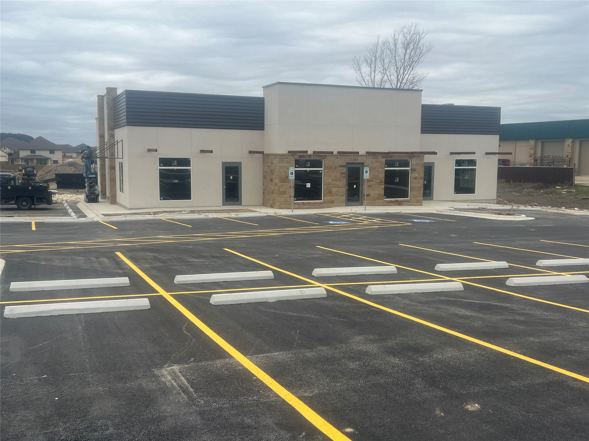 Newly paved parking lot with freshly painted yell