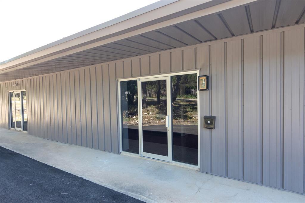 Doorway to property with board and batten siding