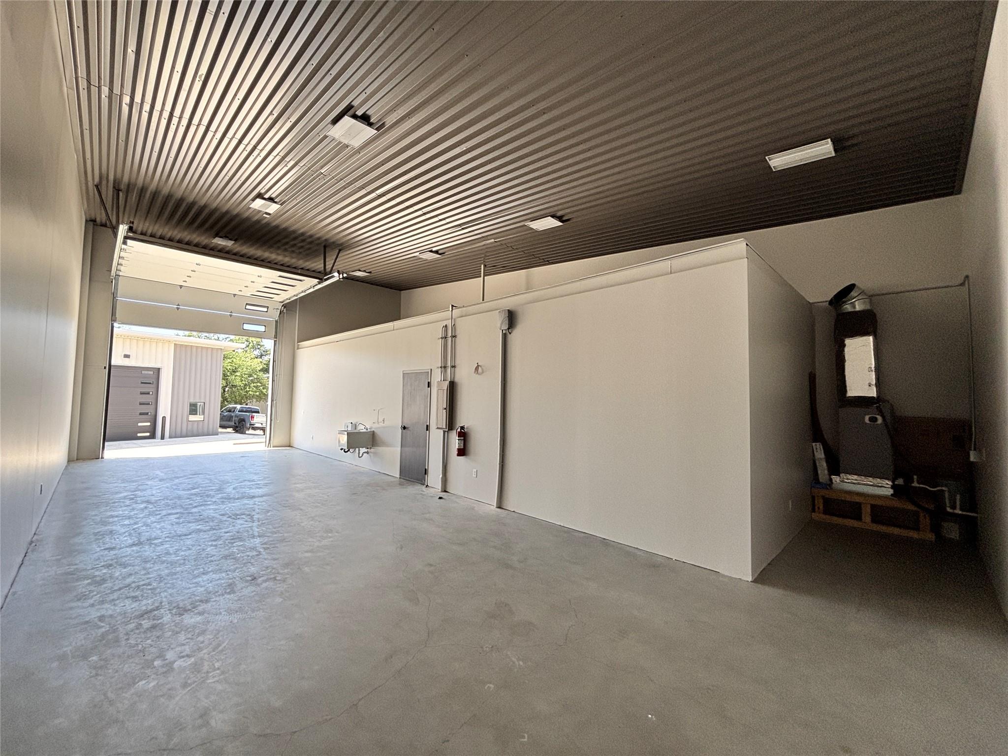 Corrugated metal ceilings and concrete floors def