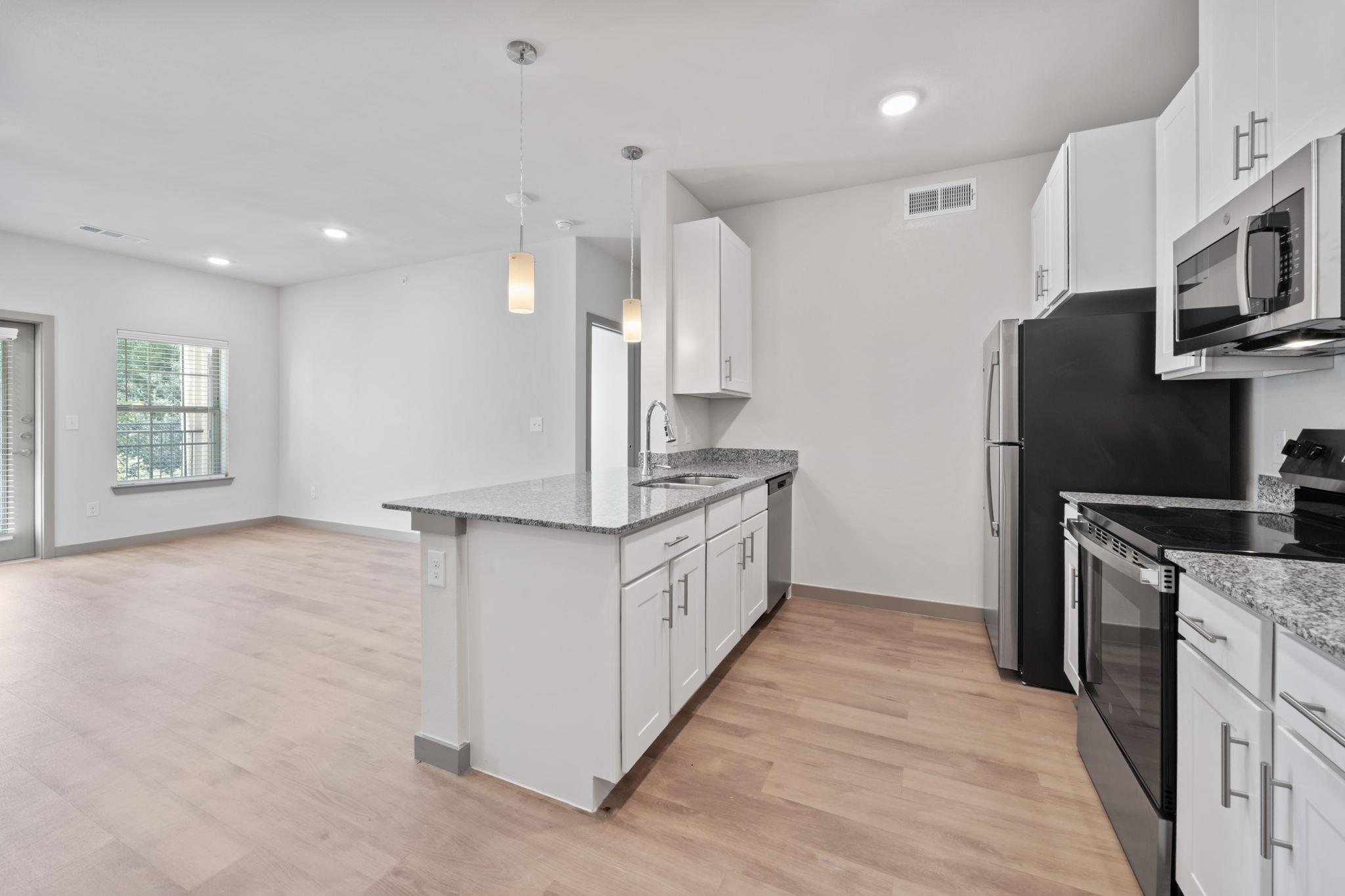 Kitchen with stainless steel appliances, light st