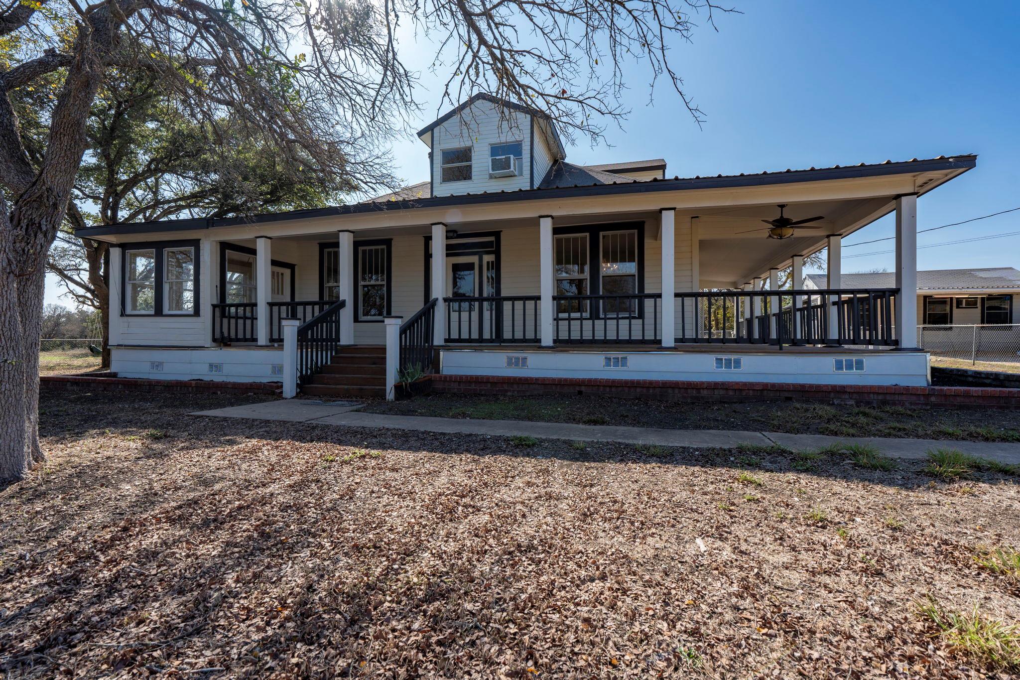 Farmhouse featuring crawl space, covered porch, a