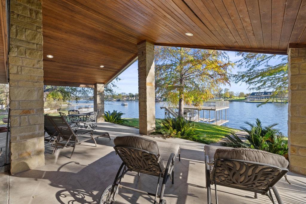 View of patio / terrace featuring a water view an