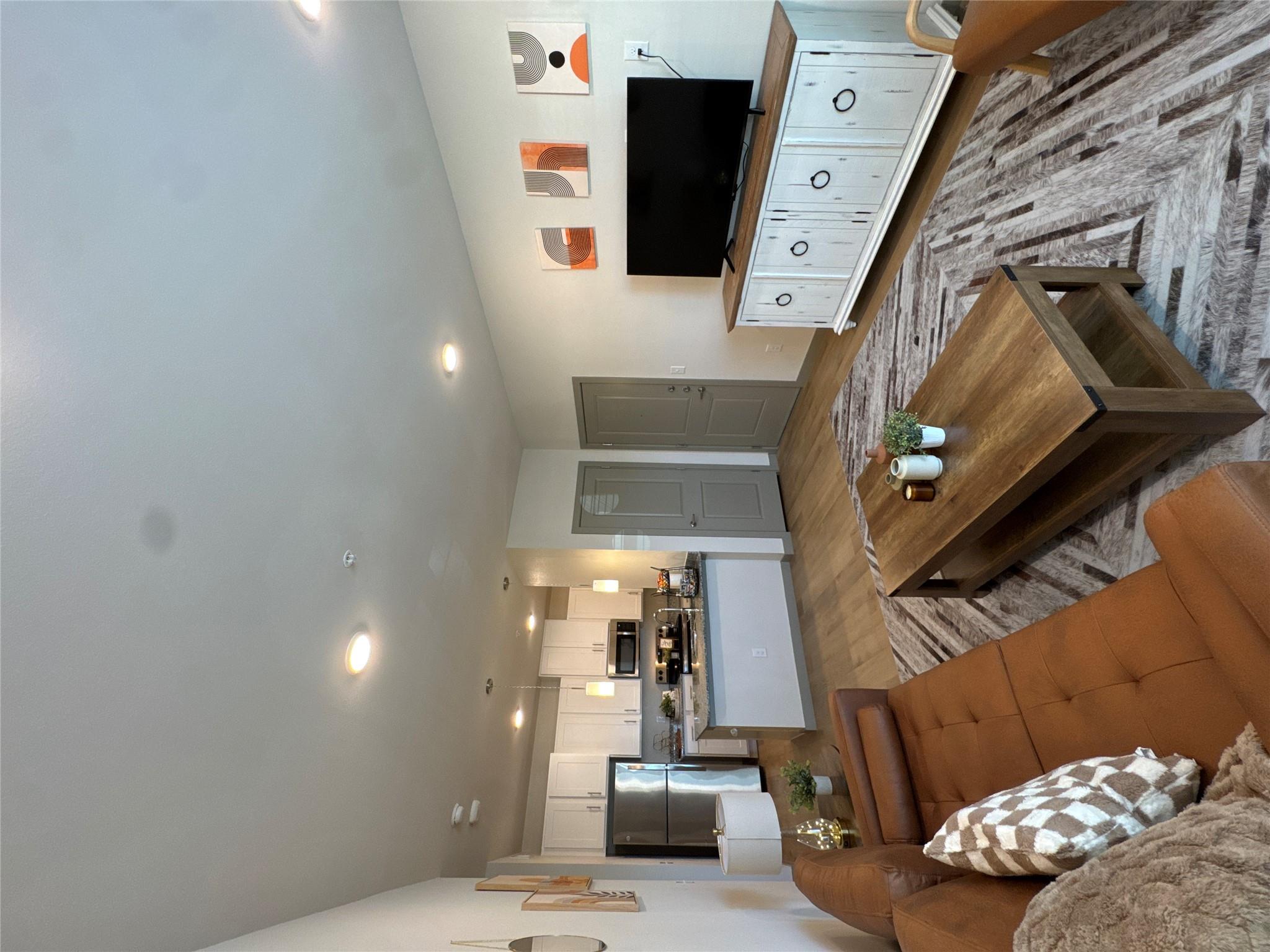 Living room with wood finished floors and recesse