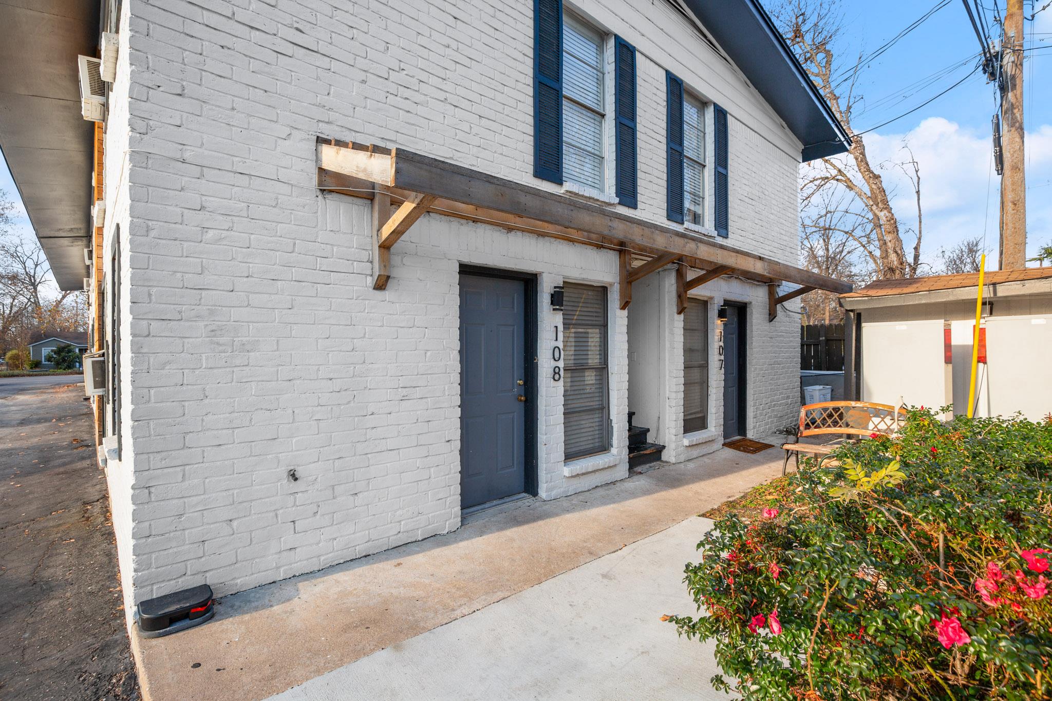 Doorway to property with brick siding