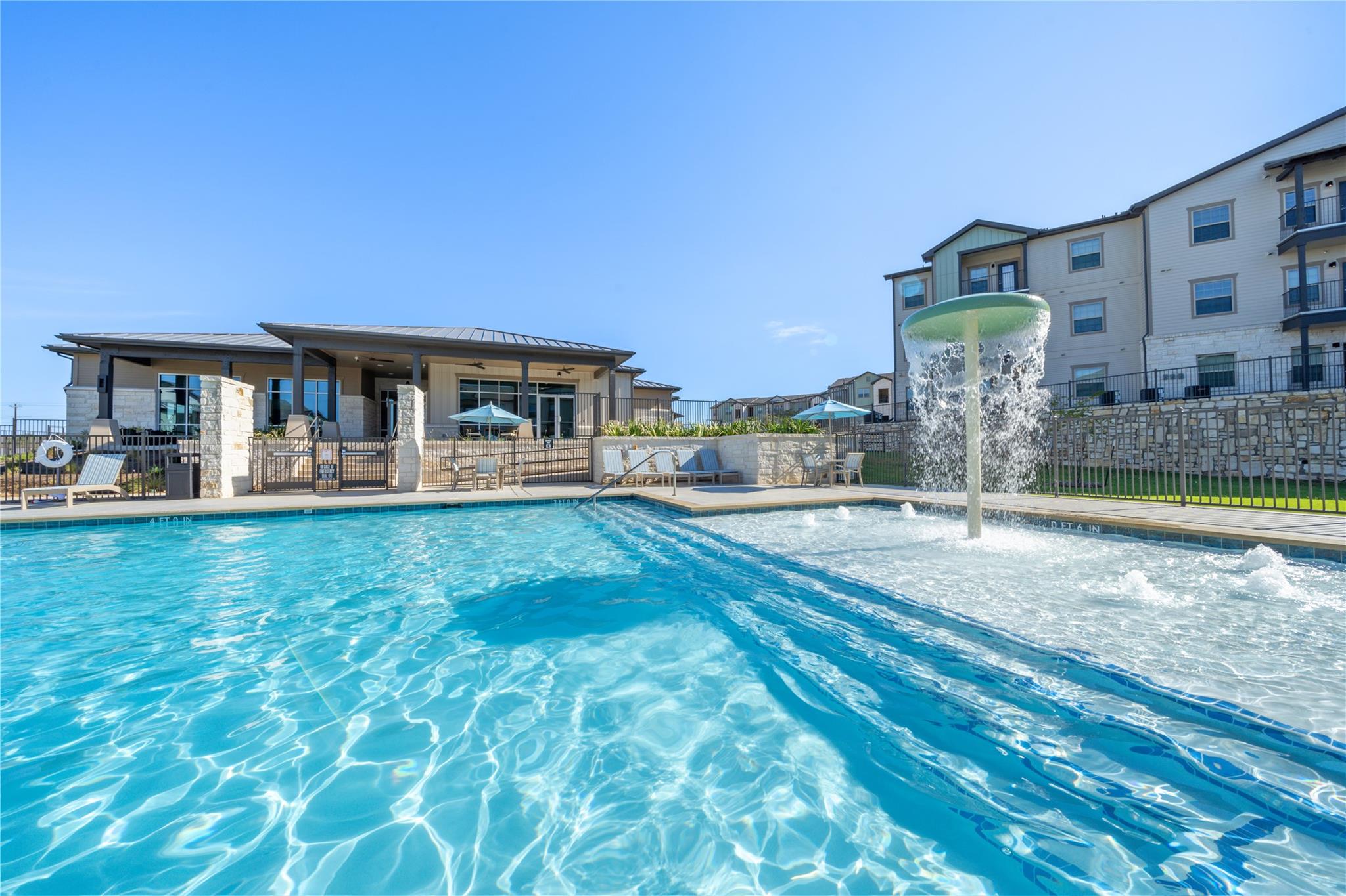 Community pool featuring a patio