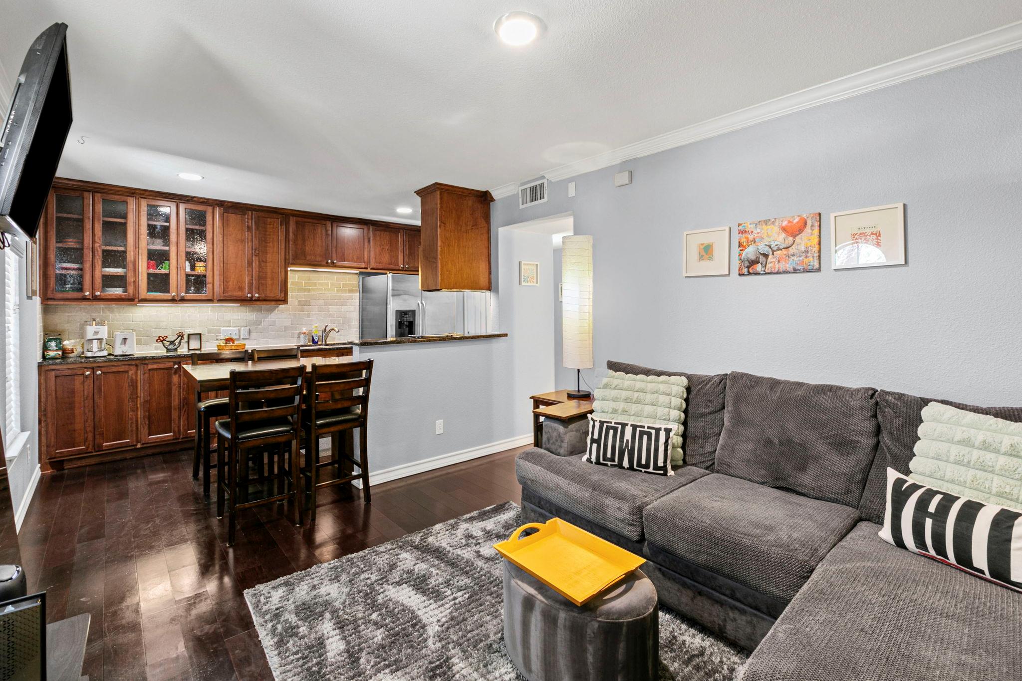 An inviting open-concept layout connects the kitc