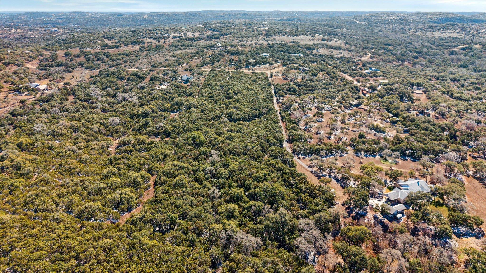 Aerial view of property's location with a heavily