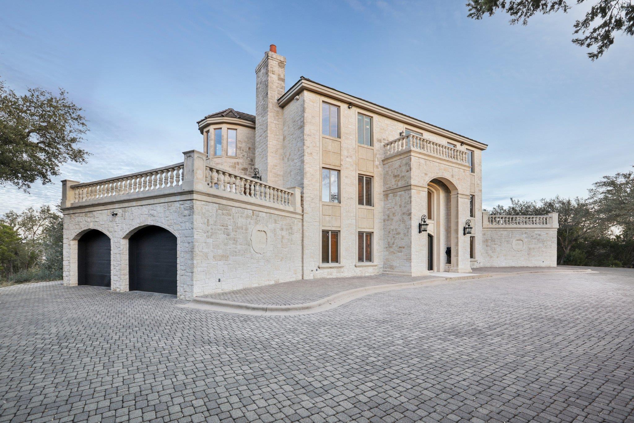 View of front of house with a chimney, stone sidi