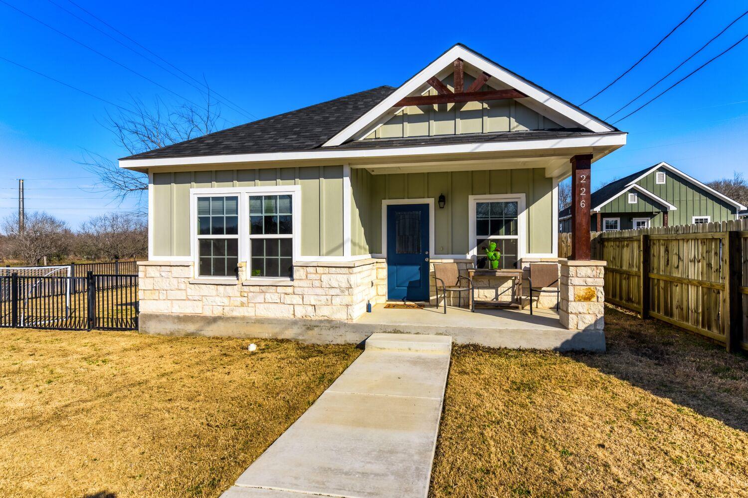 View of front of house featuring covered porch, b