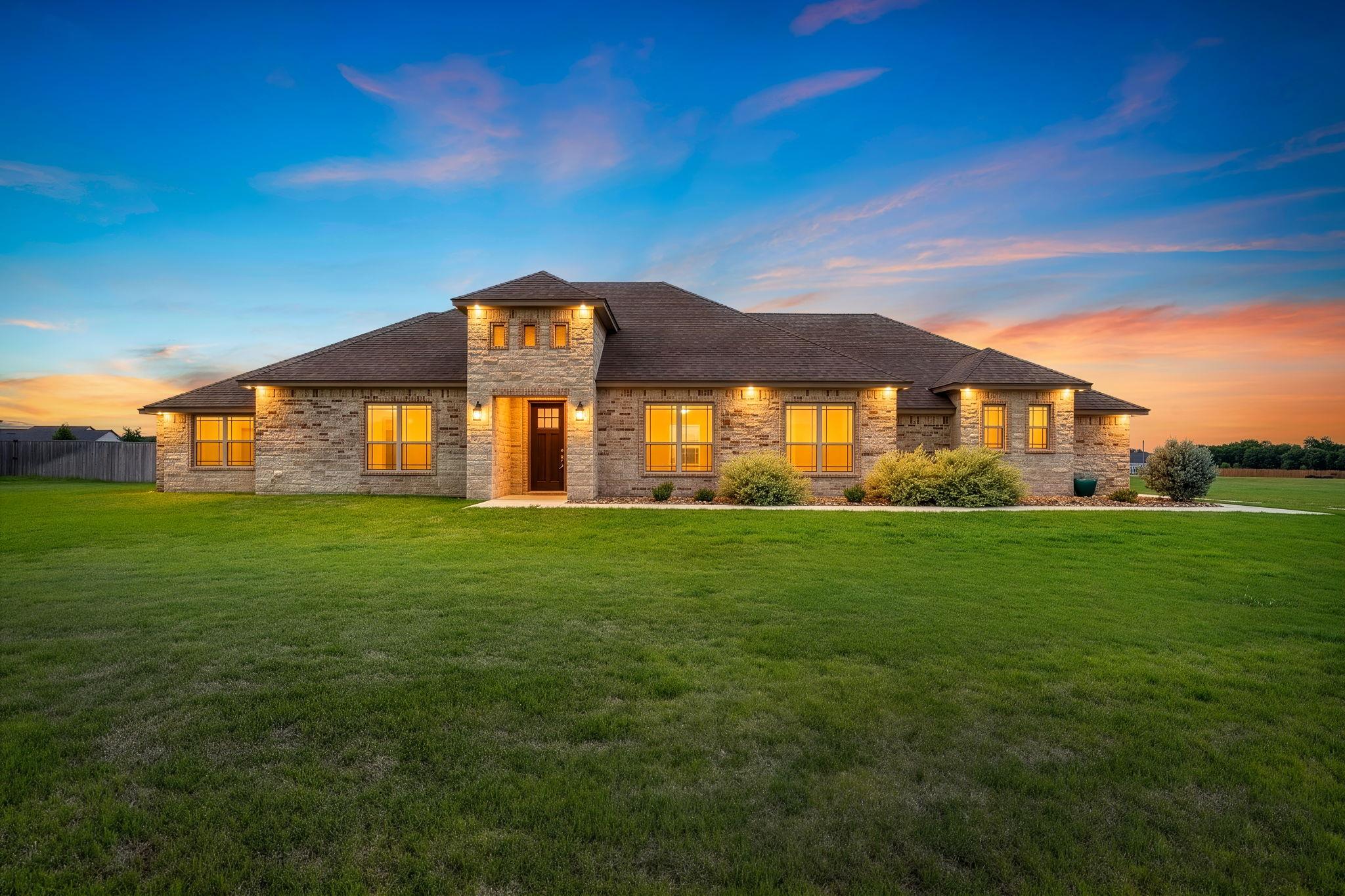 A classic brick exterior with inviting warm light