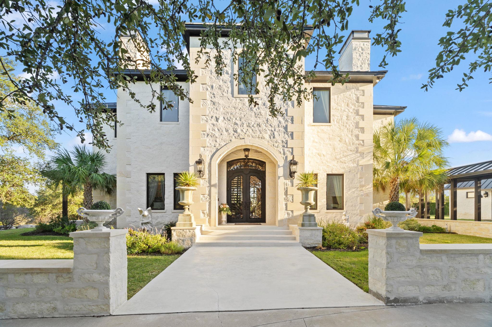View of front of house with a chimney, stone sidi