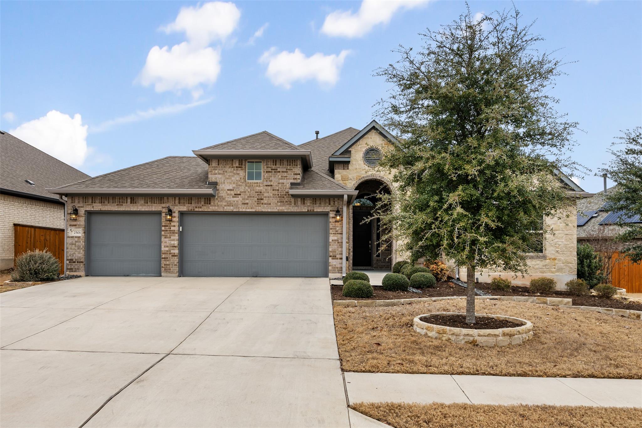French country inspired facade featuring a shingl
