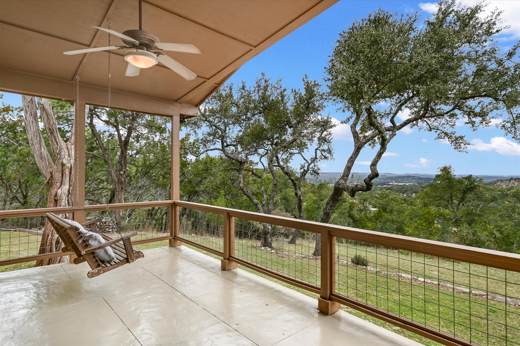 Balcony featuring ceiling fan